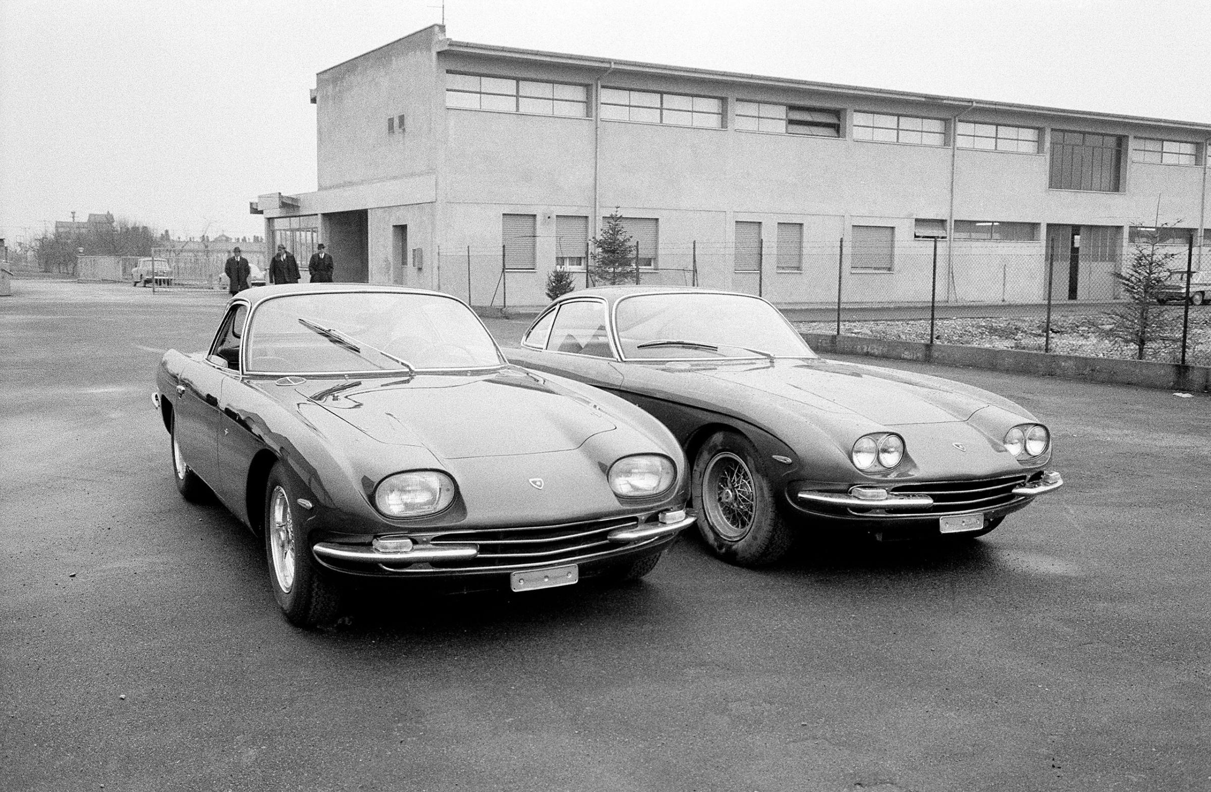 Lamborghini 400GT 2+2, with four separate headlamps, is introduced to the Press alongside the prior 350GT model, which had followed the 350GTV. 1966.