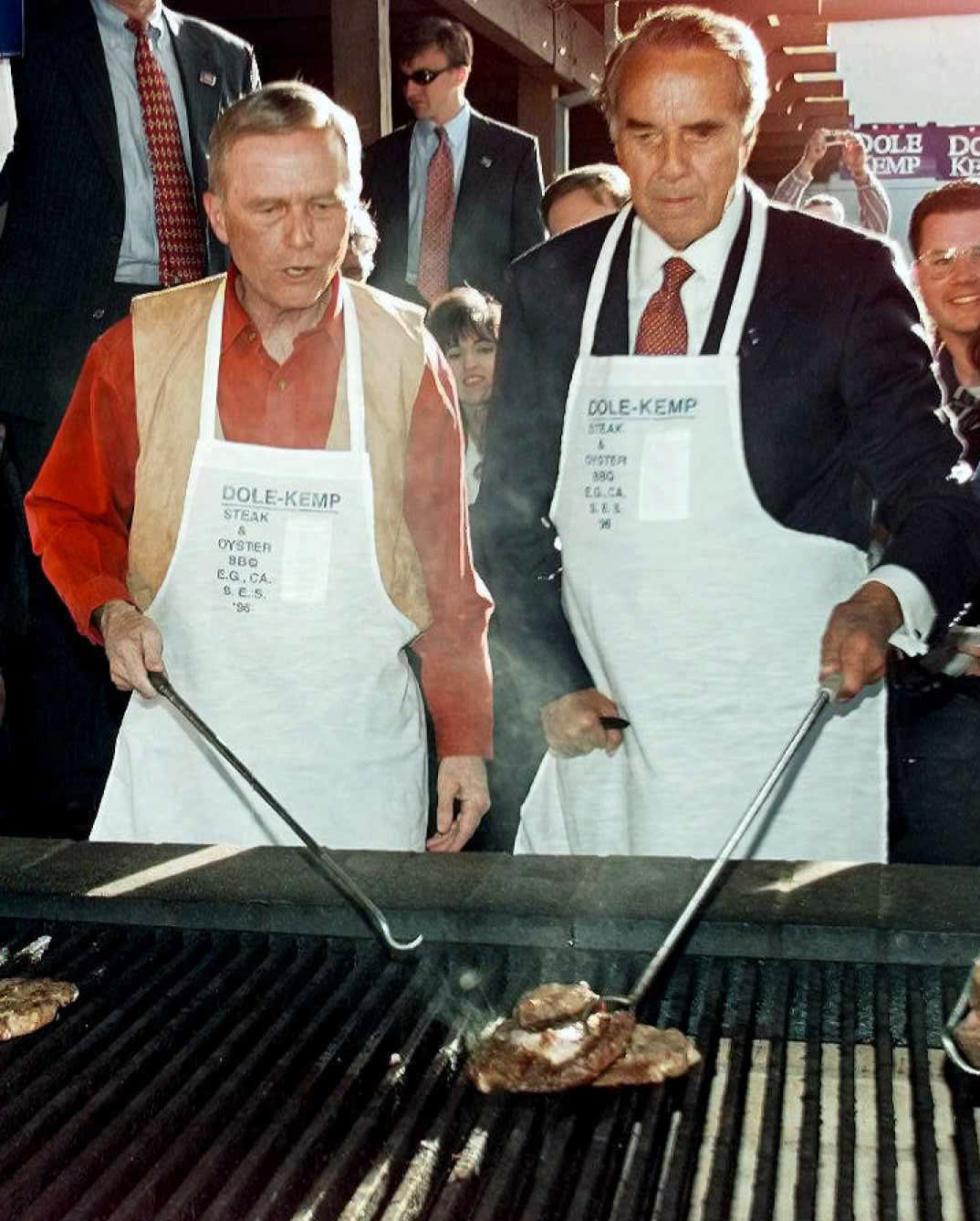 Republican presidential candidate Bob Dole and California Governor Pete Wilson grill a steak during the annual Republican steak and Oyster Feed in Sacramento, Calif., Oct. 27, 1996. Dole was in the middle of a three day campaign trip through California.