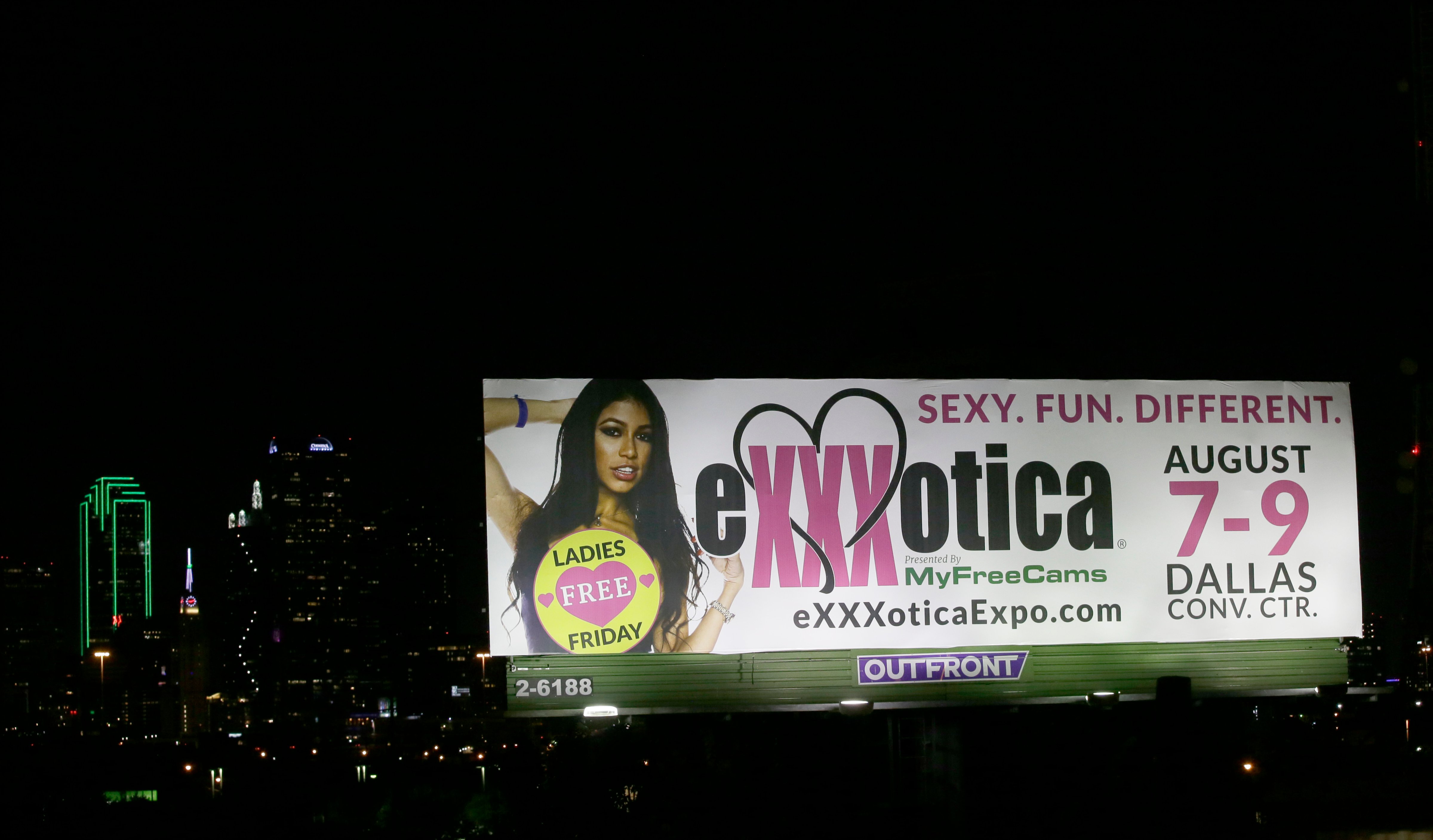 A billboard sign advertises the Exxxotica expo in Dallas, on July 31, 2015. (LM Otero—AP)