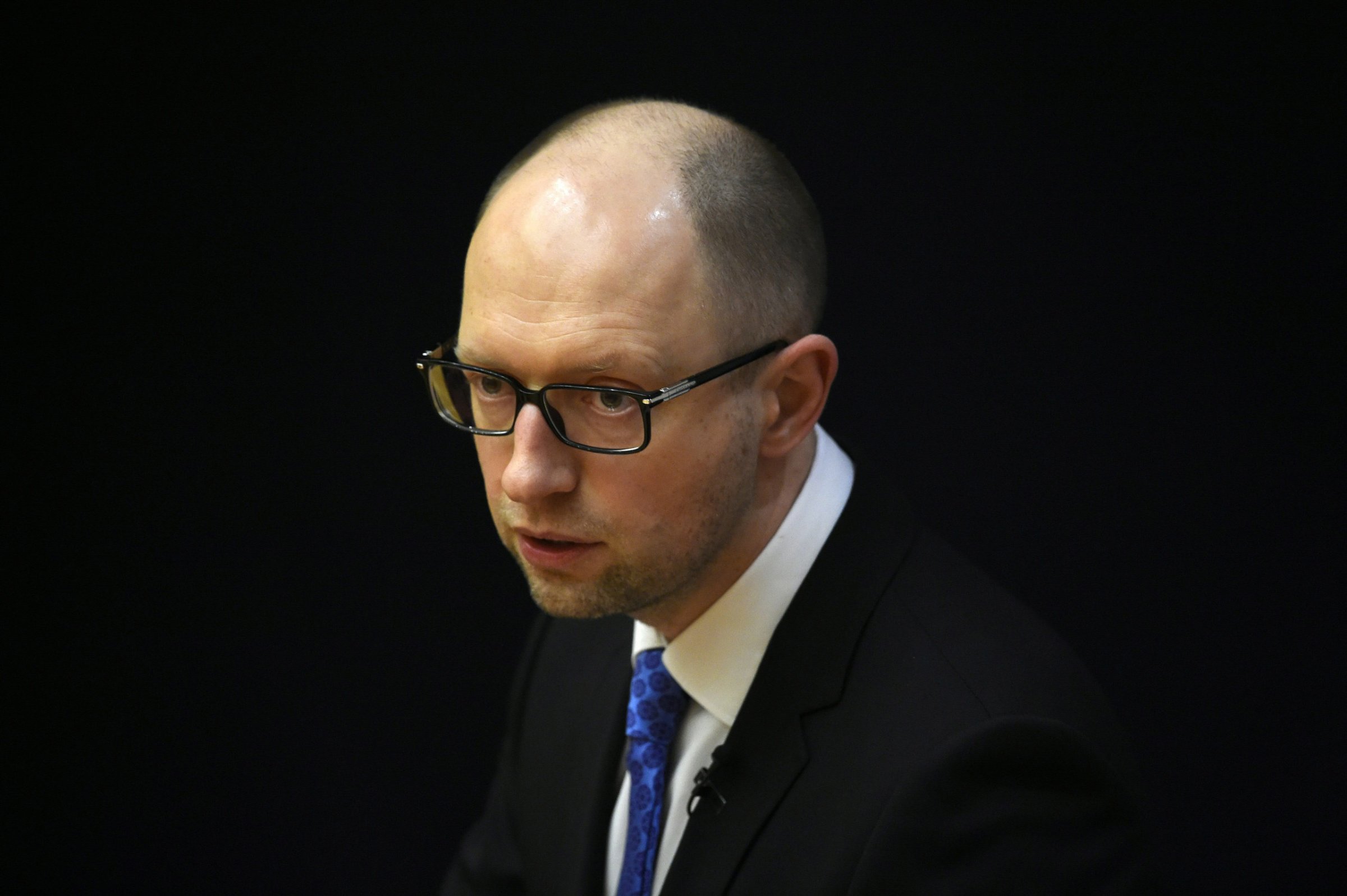 (FILES) This file photo taken on April 1, 2015 shows Ukrainian Prime Minister Arseniy Yatsenyuk delivering a speech at the "Europa-Forum" series of events organised by the Konrad-Adenauer-Stiftung foundation in Berlin. Ukraine's Prime Minister Arseniy Yatsenyuk said in a televised address on April 10, 2016 that he has decided to resign, less than two months after surviving a no-confidence vote in parliament. "I decided to step down from the post of prime minister of Ukraine," he said in a message aired by Ukrainian channels, Interfax news agency reported. / AFP PHOTO / TOBIAS SCHWARZTOBIAS SCHWARZ/AFP/Getty Images