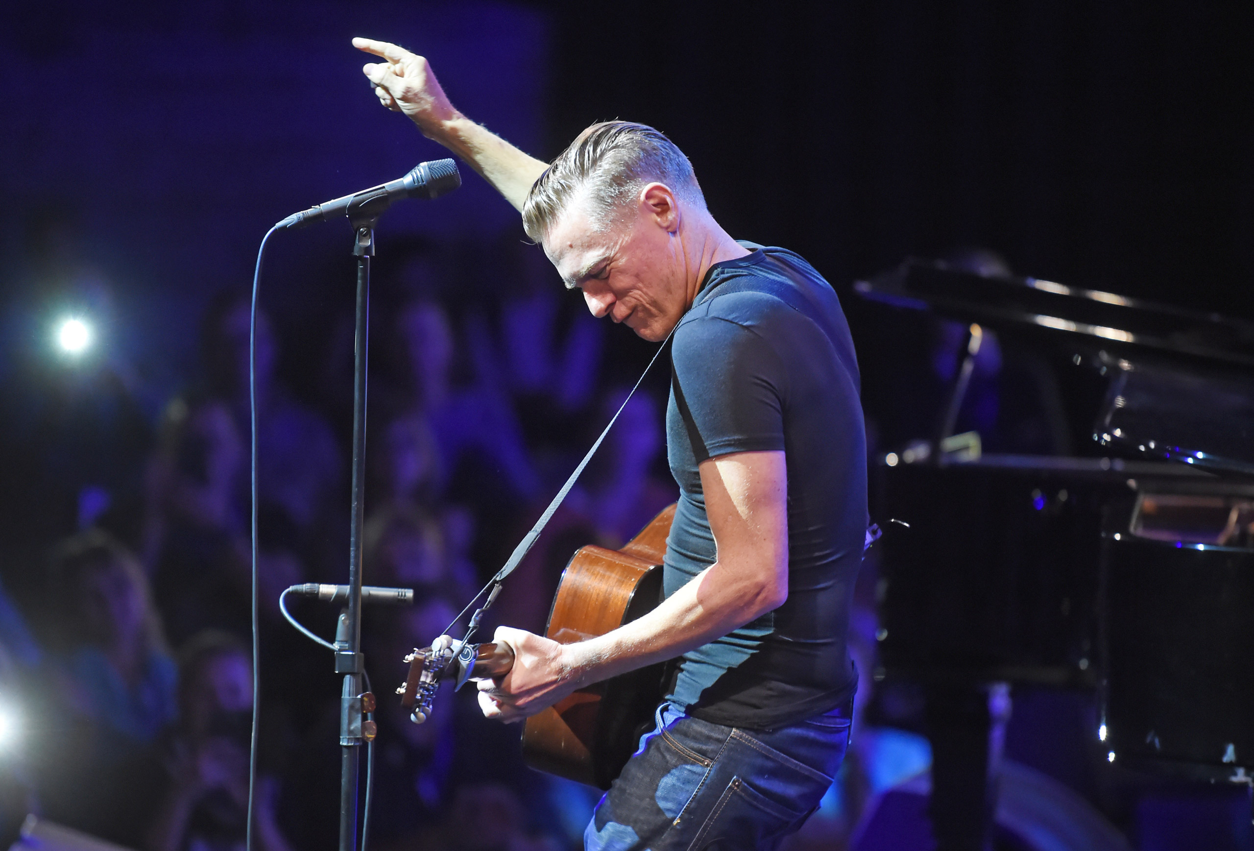Canadian rock singer and musician Bryan Adams performs on the Badisches Staatstheater theatre in Karlsruhe, Germany, 13 October 2015. The occasion is a private concert from radio station Radio Regenbogen. Photo by: Uli Deck/picture-alliance/dpa/AP Images