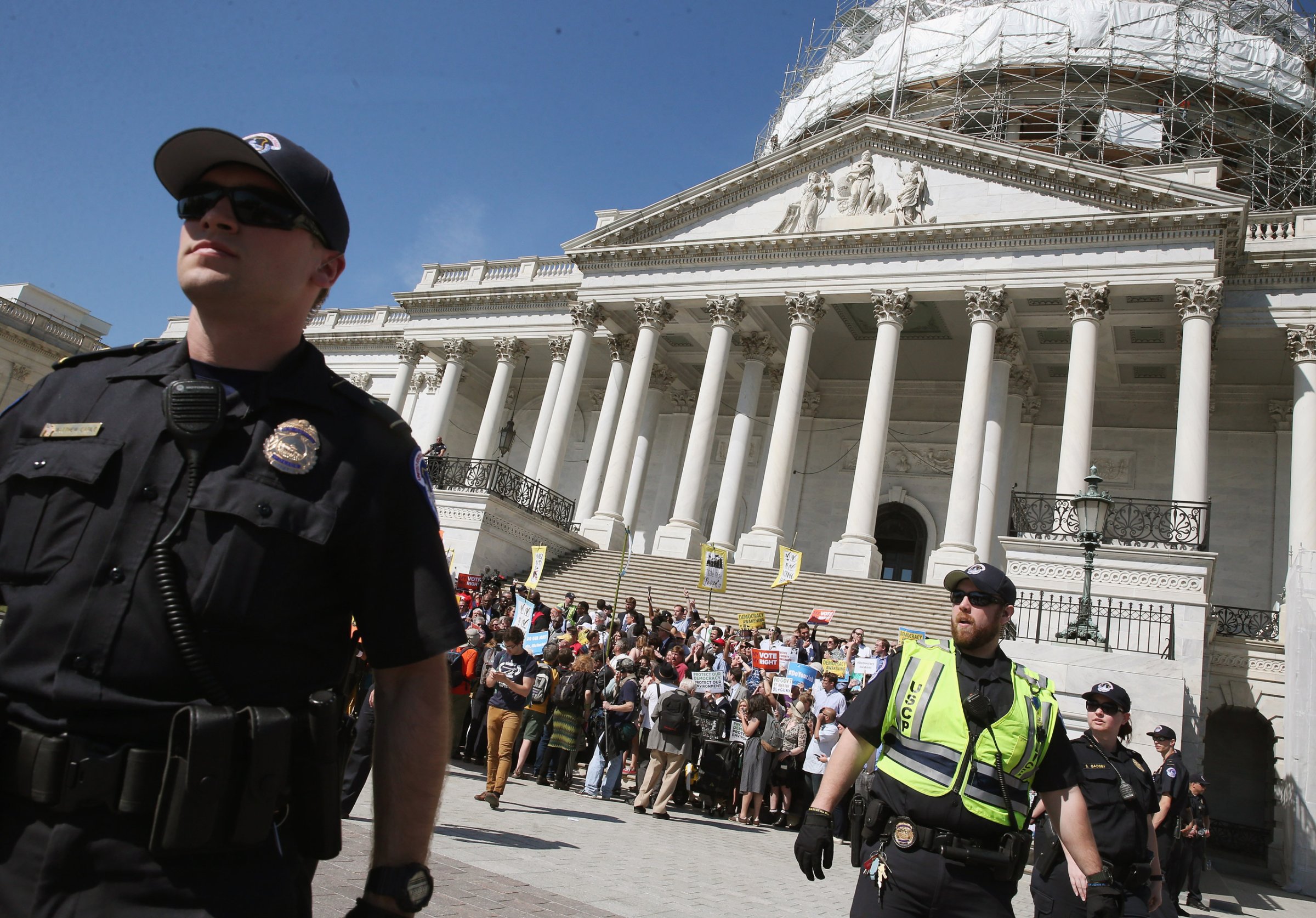WASHINGTON, DC - APRIL 18: US Capitol Police give protesters a warning to move away from the front of the Capitol or get arrested, April 18, 2016 in Washington, DC. Protest groups Public Citizen and People for the American Way have been protesting the influence of money in politics over the last week, with more than 900 arrests reported. (Photo by Mark Wilson/Getty Images)
