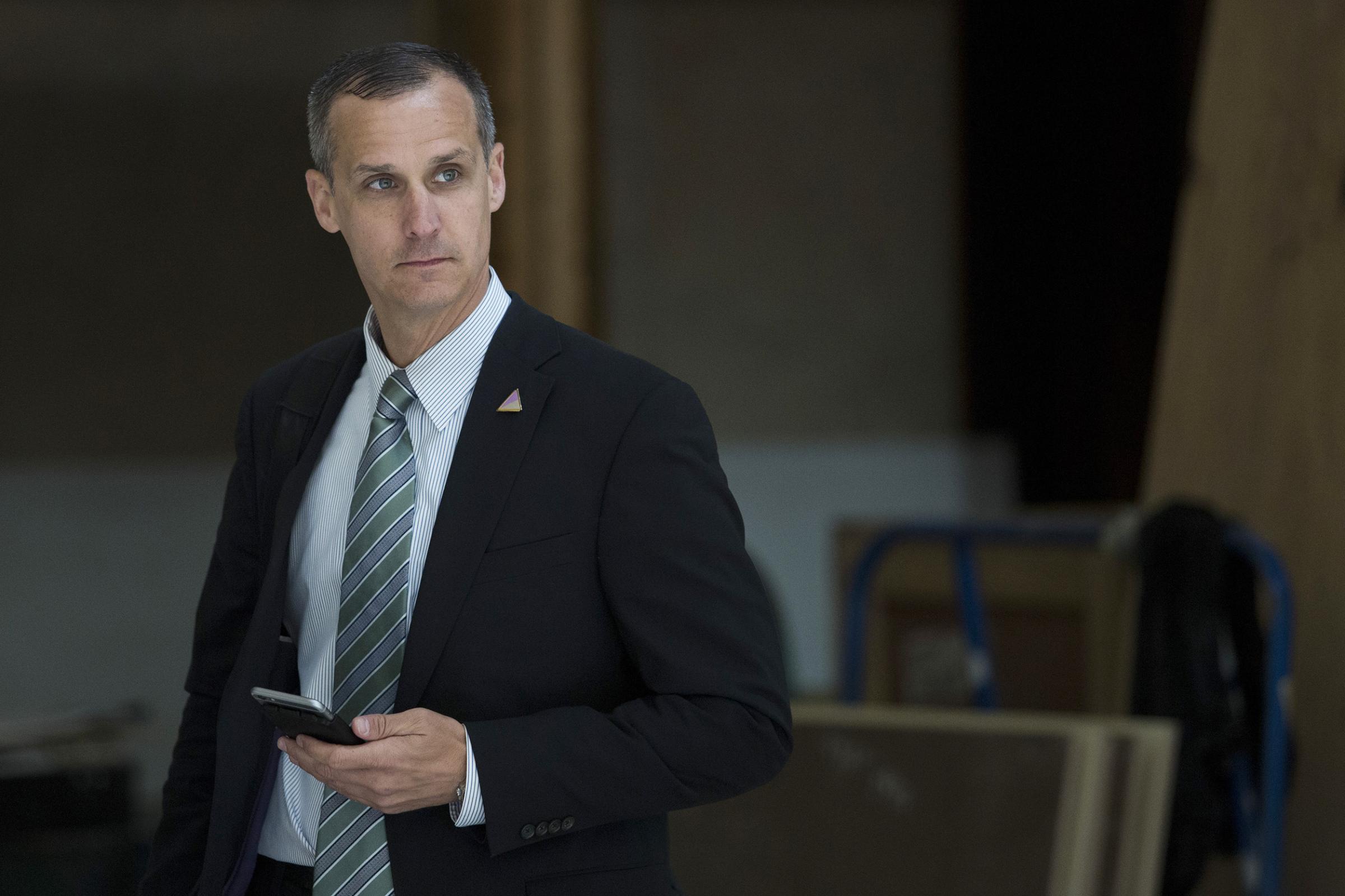 Corey Lewandowski, campaign manager for 2016 Republican presidential candidate Donald Trump, listens as Trump speaks at the Trump International Hotel Washington DC on March 16, 2016.