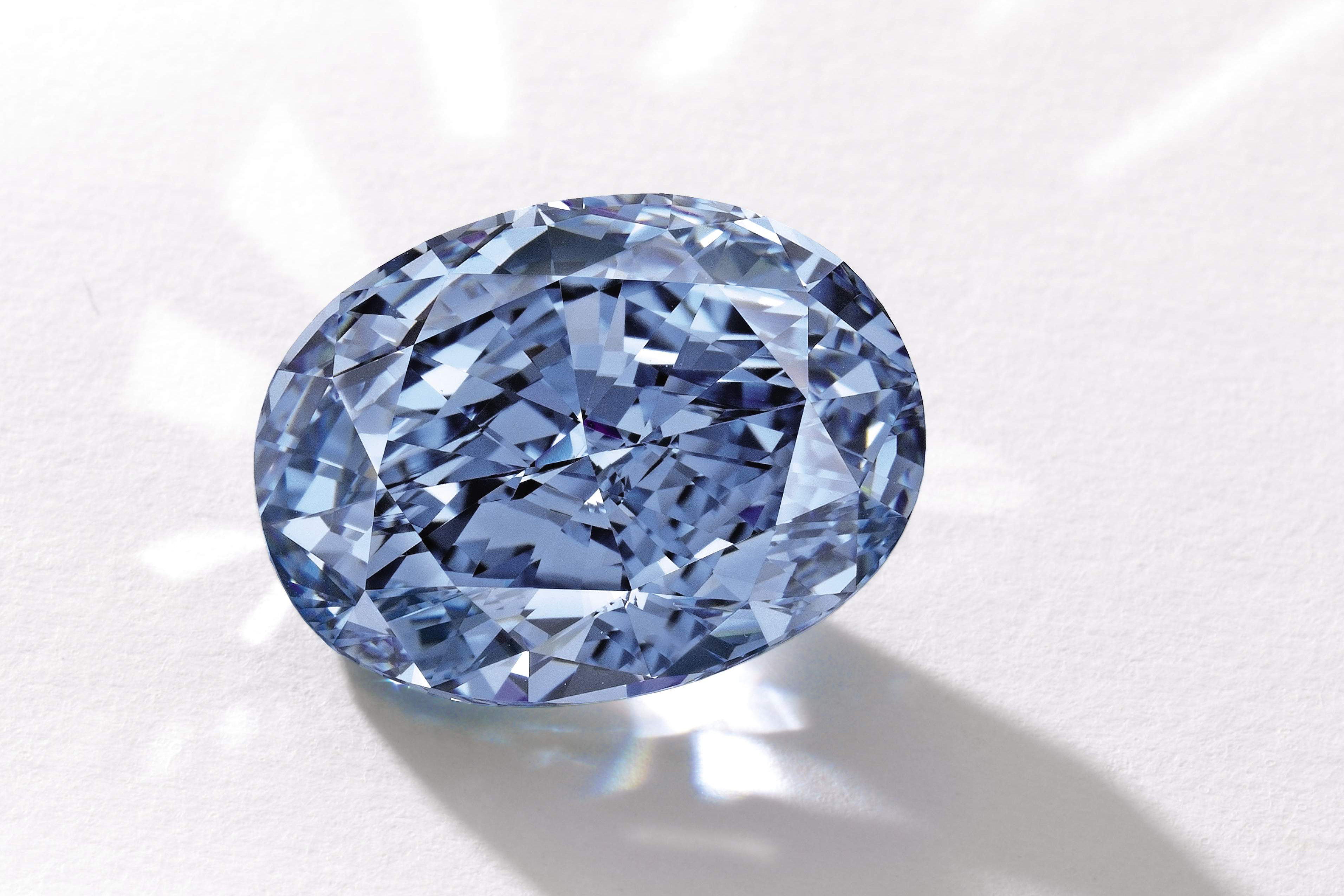 This photo provided by Sotheby's shows a 10.10-carat oval, internally flawless blue diamond. The ‘De Beers Millennium Jewel 4’ is largest oval fancy vivid blue diamond ever to appear at auction. (Sotheby's)