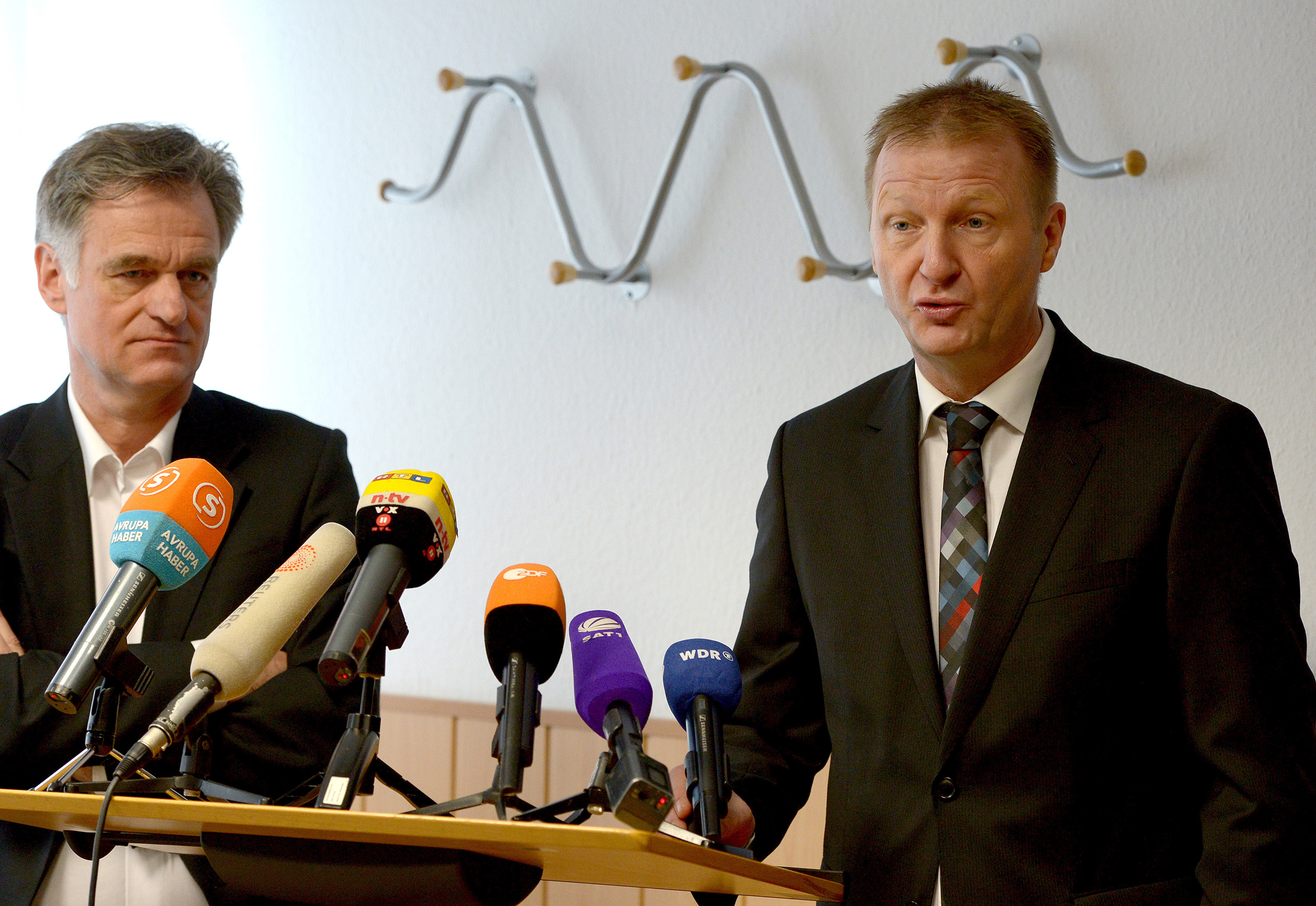 Dirk Sauerborn, left, stands next to North Rhine-Westphalia Interior Minister Ralf Jäger during a news conference on the intervention project Wegweiser, or Signpost, in Dusseldorf, Germany, March 24, 2014. (Federico Gambarini—picture-alliance/dpa/AP)