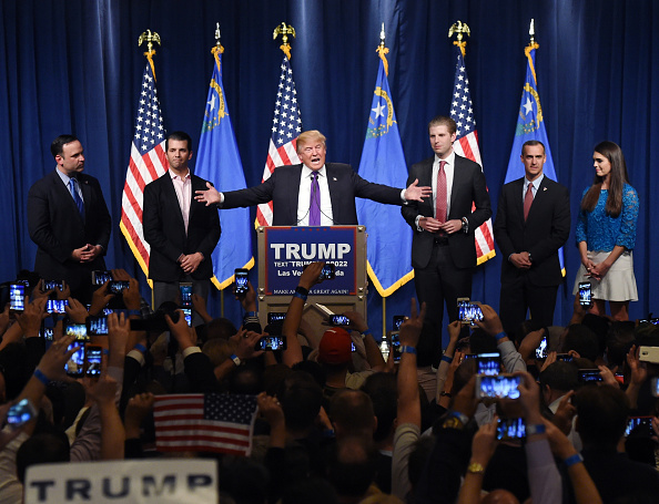 Republican presidential candidate Donald Trump (3rd L) speaks as his sons Donald Trump Jr. (2nd L) and Eric Trump (3rd R) look on during a caucus night watch party at the Treasure Island Hotel &amp; Casino on February 23, 2016 in Las Vegas, Nevada.