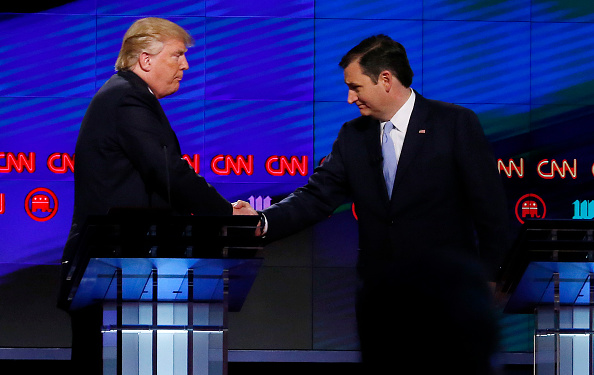 Donald Trump (L) shakes hands with Texas Senator Ted Cruz (R) following the CNN Republican Presidential Debate March 10, 2016 in Miami, Florida.