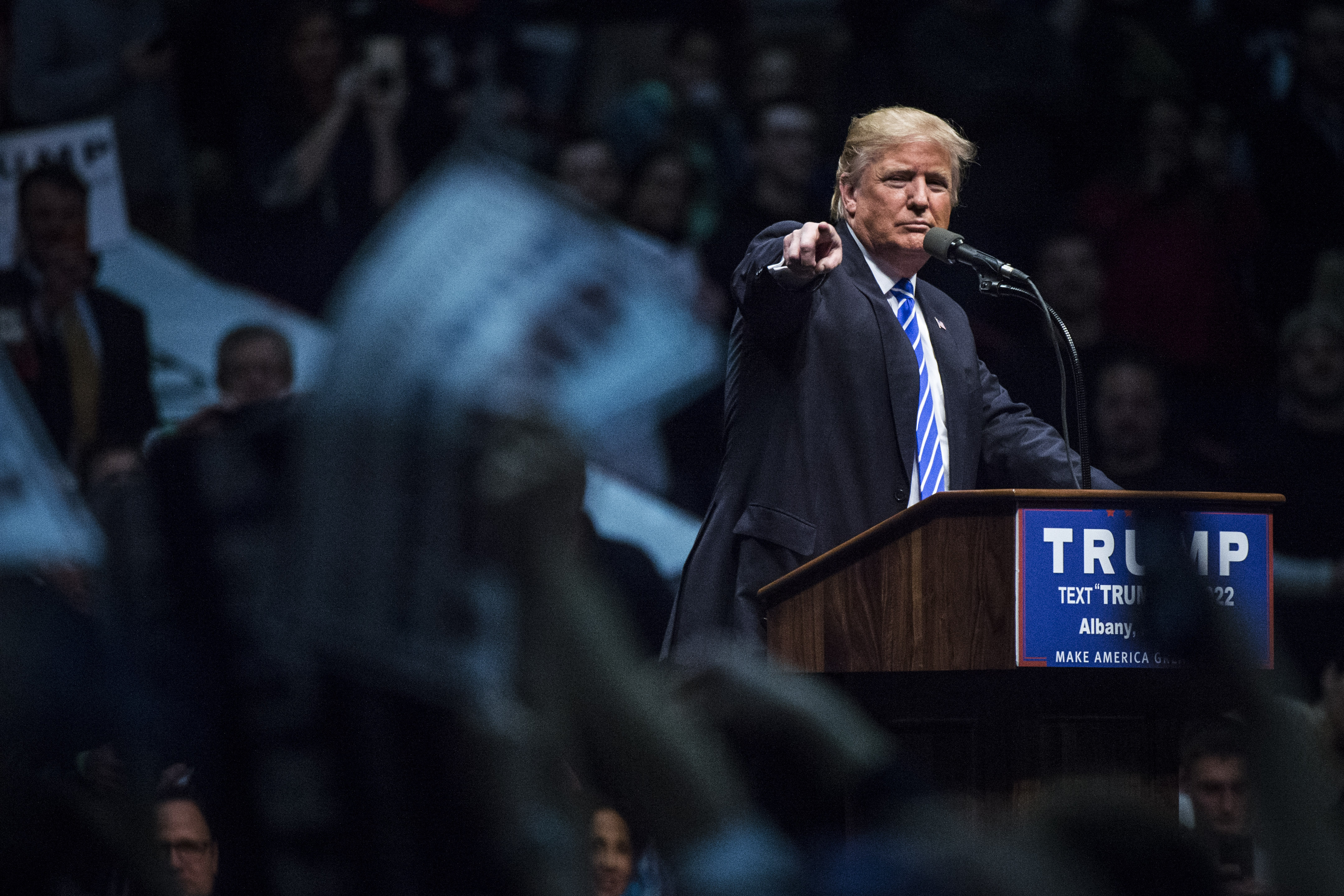 Republican presidential candidate Donald Trump points to a protestor as he speaks during a campaign event at the Times Union Center in Albany, N.Y. on April 11. (Jabin Botsford—The Washington Post/Getty Images)