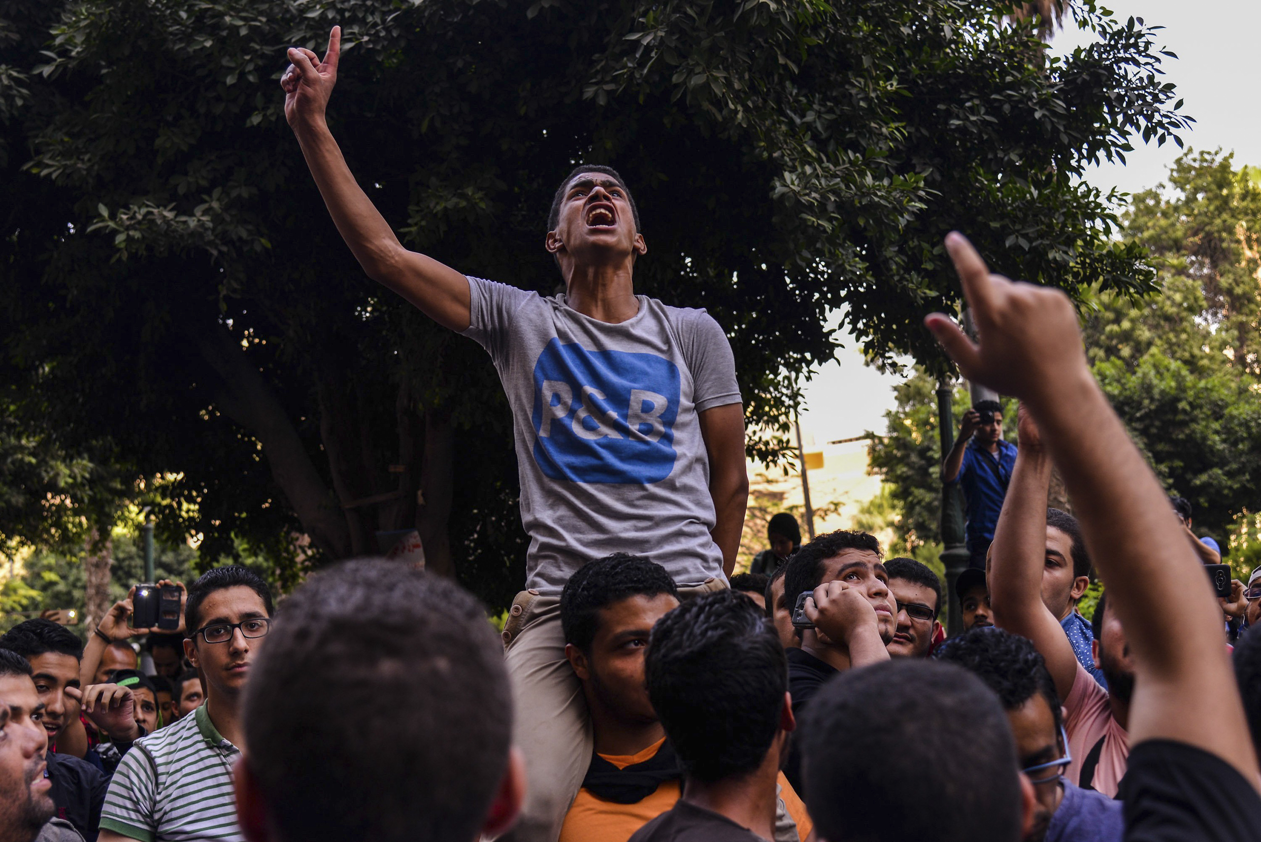 Egyptians demonstrate against President Abdel-Fattah al-Sisi in Mesaha square of Cairo's Dokki district, April 25, 2016.  Police fired tear gas and bird-shots to disperse hundreds of demonstrators calling on Sisi to step down over his government's decision to surrender control over two strategic Red Sea islands to Saudi Arabia. (Mostafa Darwish—AP)