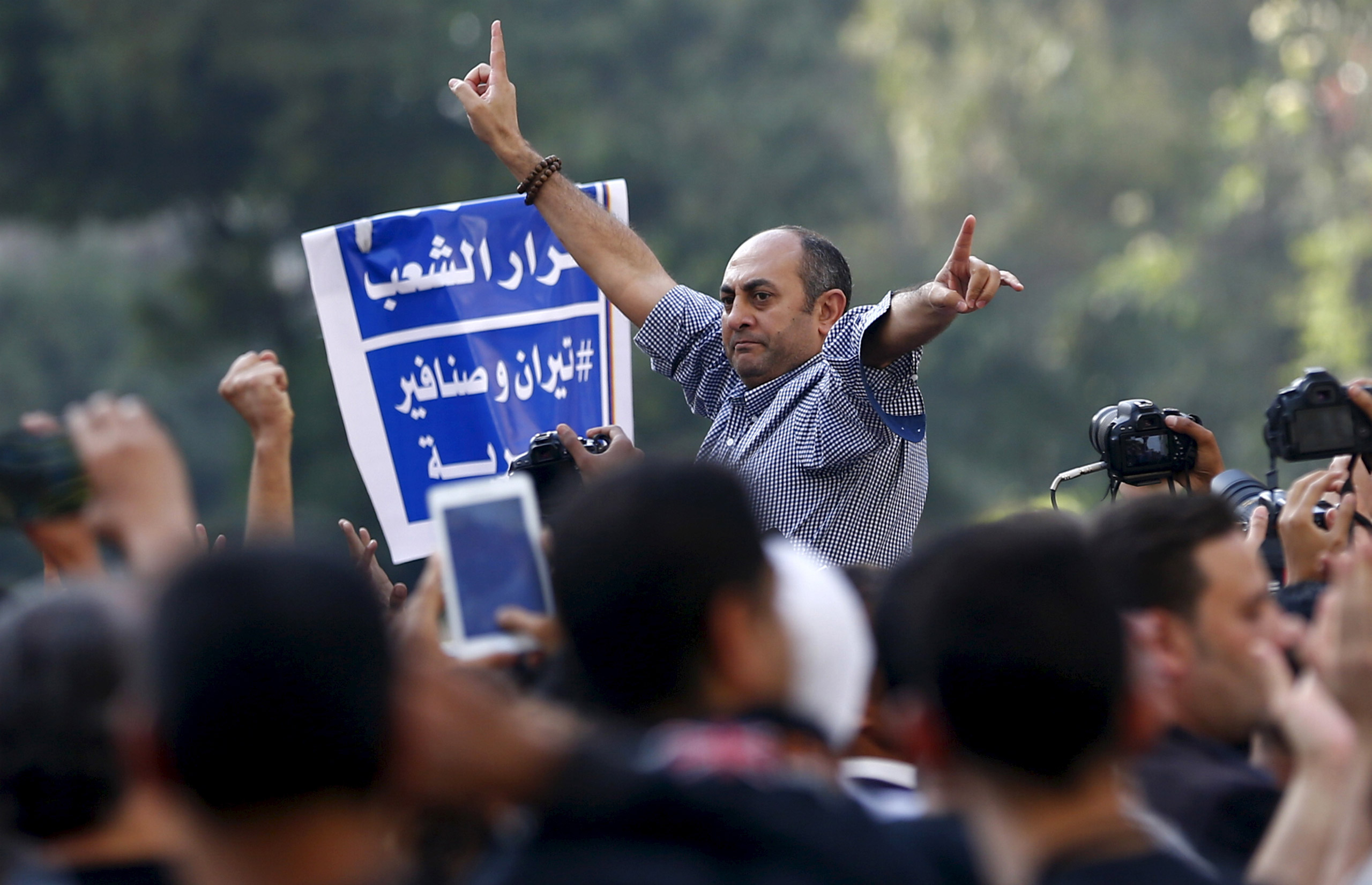 A former presidential candidate and lawyer Khaled Ali shouts slogans against President Abdel Fattah al-Sisi and the government during a demonstration in Cairo on April 15, 2016. (Amr Dalsh—Reuters)