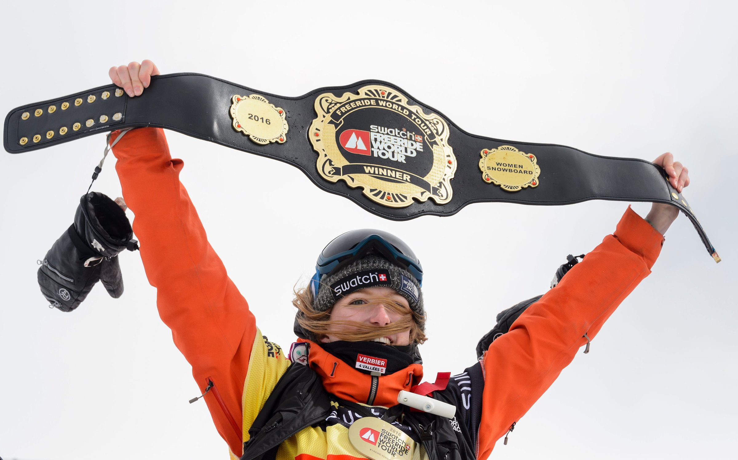 World champion Switzerland's Estelle Balet waves with the overall belt after she won the women's snowboard event at the Bec des Rosses during the Verbier Xtreme Freeride World Tour final on April 2, 2016 above the Swiss Alps resort of Verbier.