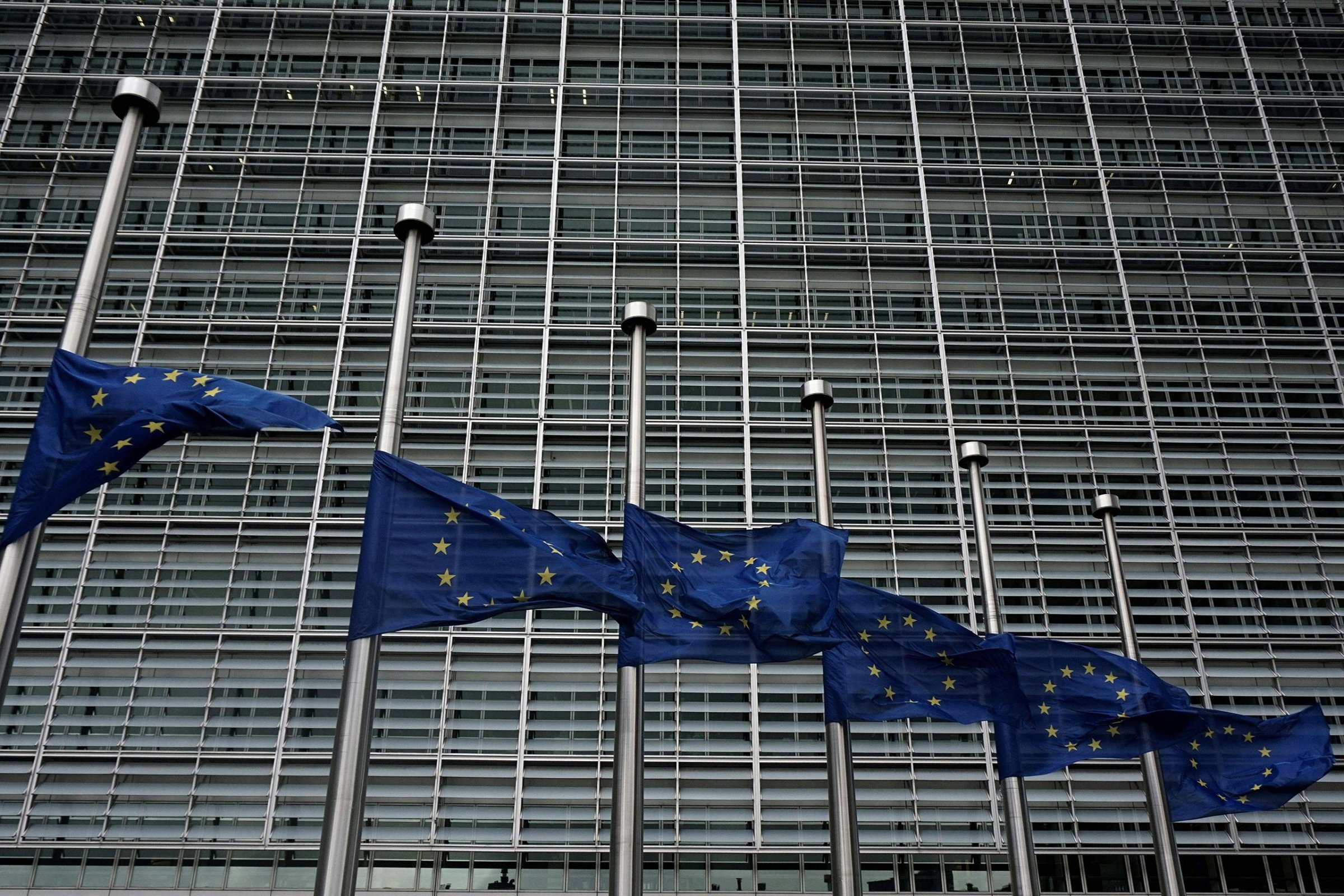 European Union flags fly at half-staff outside the European Commission building in Brussels on March 23, 2016, a day after twin blasts hit the Belgian capital.