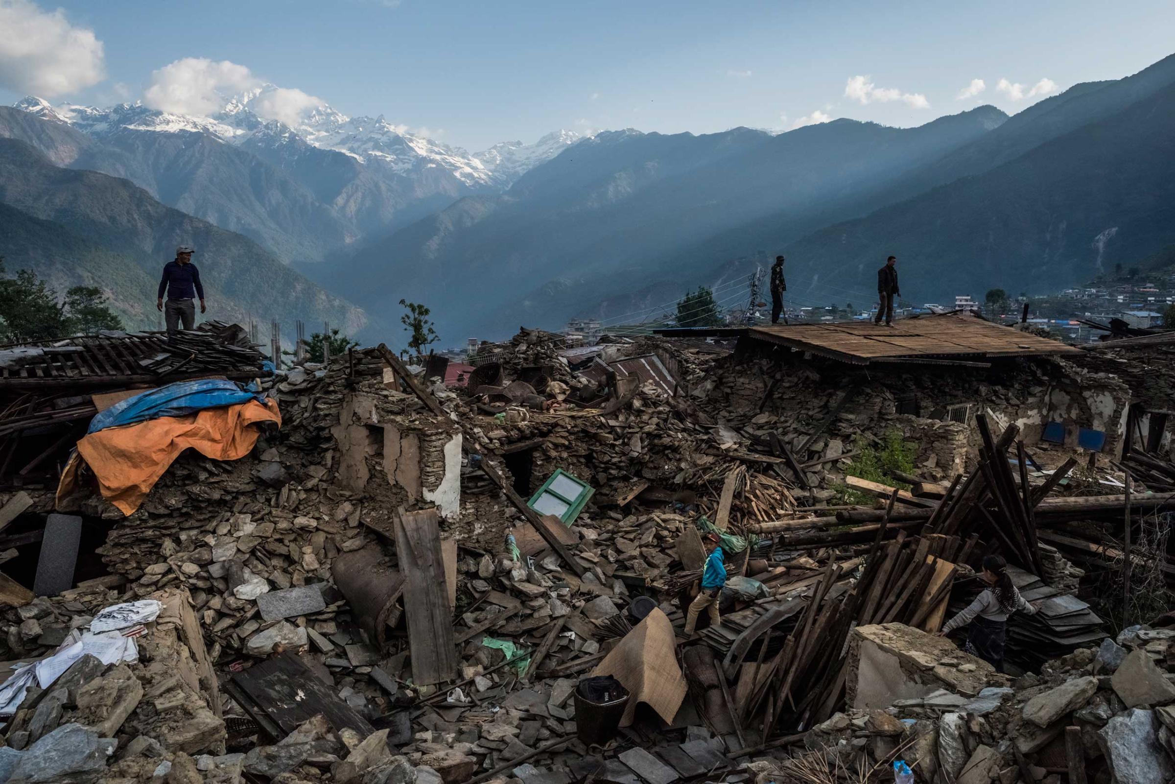 Residents searching for salvageable items in their earthquake-destroyed home in the village of Barpak, Nepal, the epicenter of the April 25 earthquake. May 6, 2015.