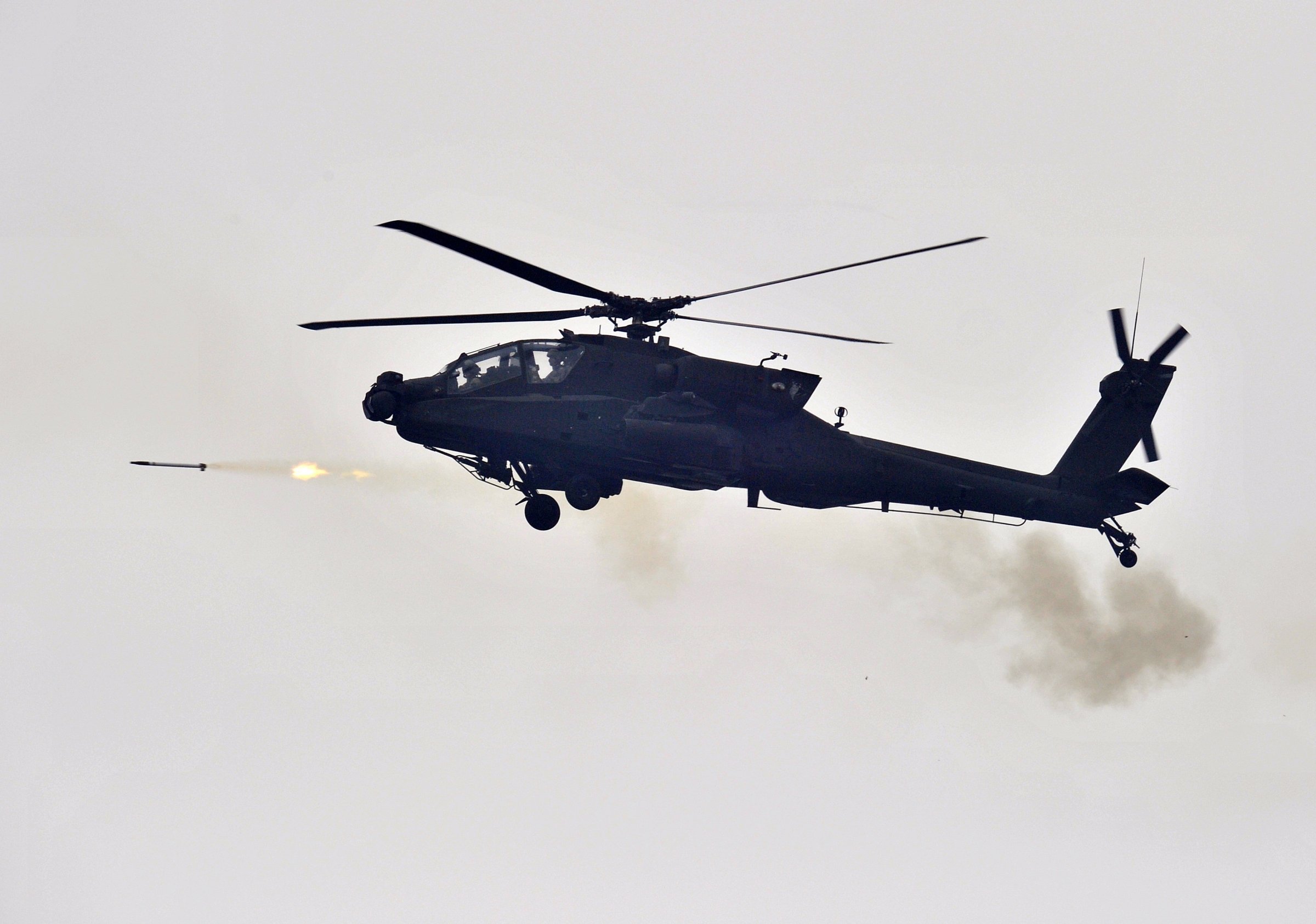 A US AH-64 Apache helicopter fires rocke