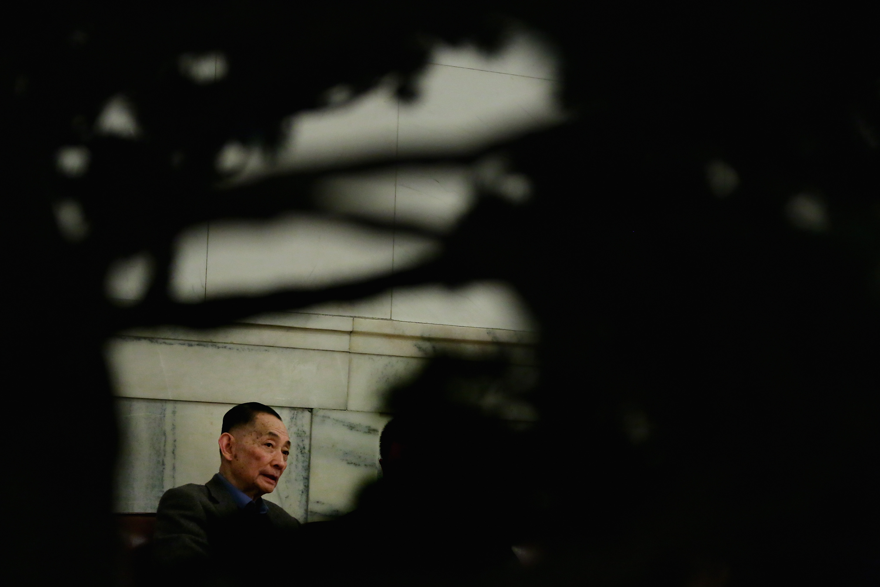 Mei Baojiu, Peking opera master, rests outside the meeting room of the Great Hall of the People during a plenary session of the Chinese People's Political Consultative Conference, at which he is a delegate, on March 7, 2013, in Beijing (Feng Li—Getty Images)
