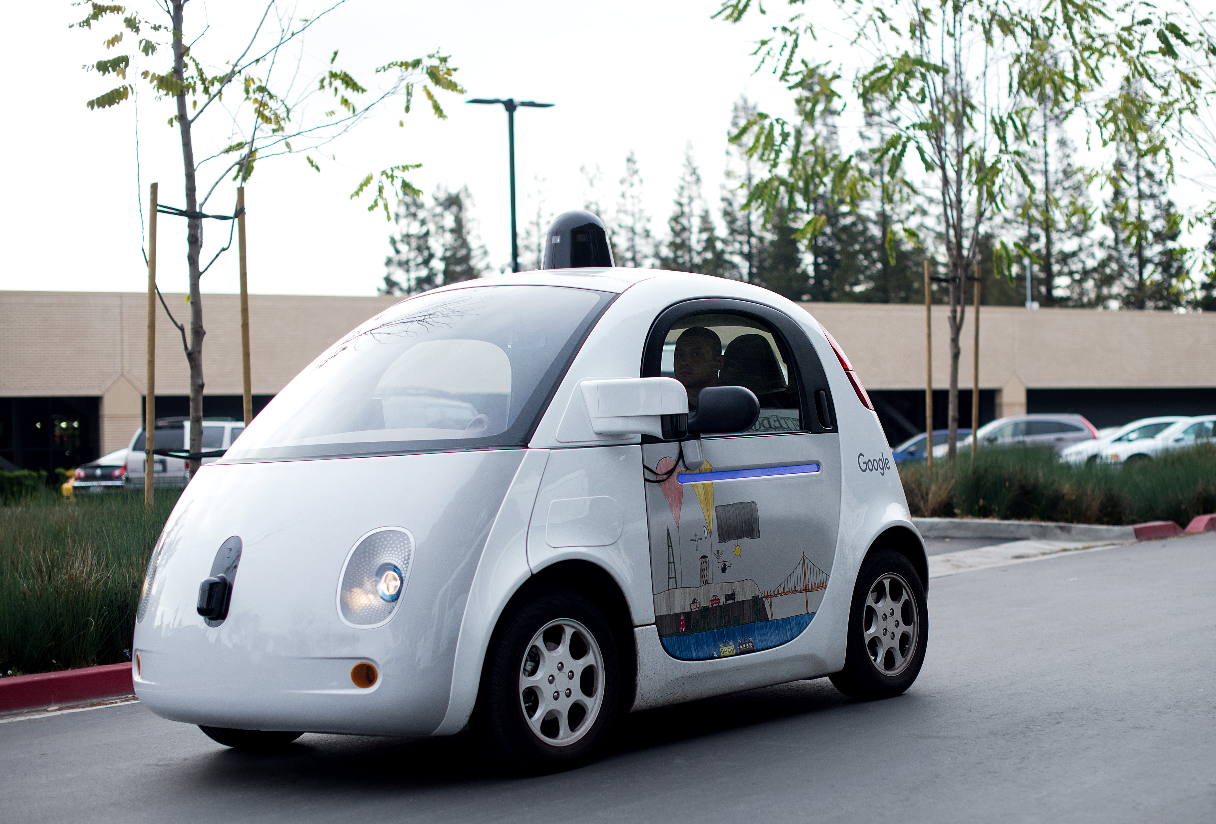 A self-driving car traverses a parking lot at Google's headquarters in Mountain View, California on Jan. 8, 2016 (Noah Berger—AFP/Getty Images)
