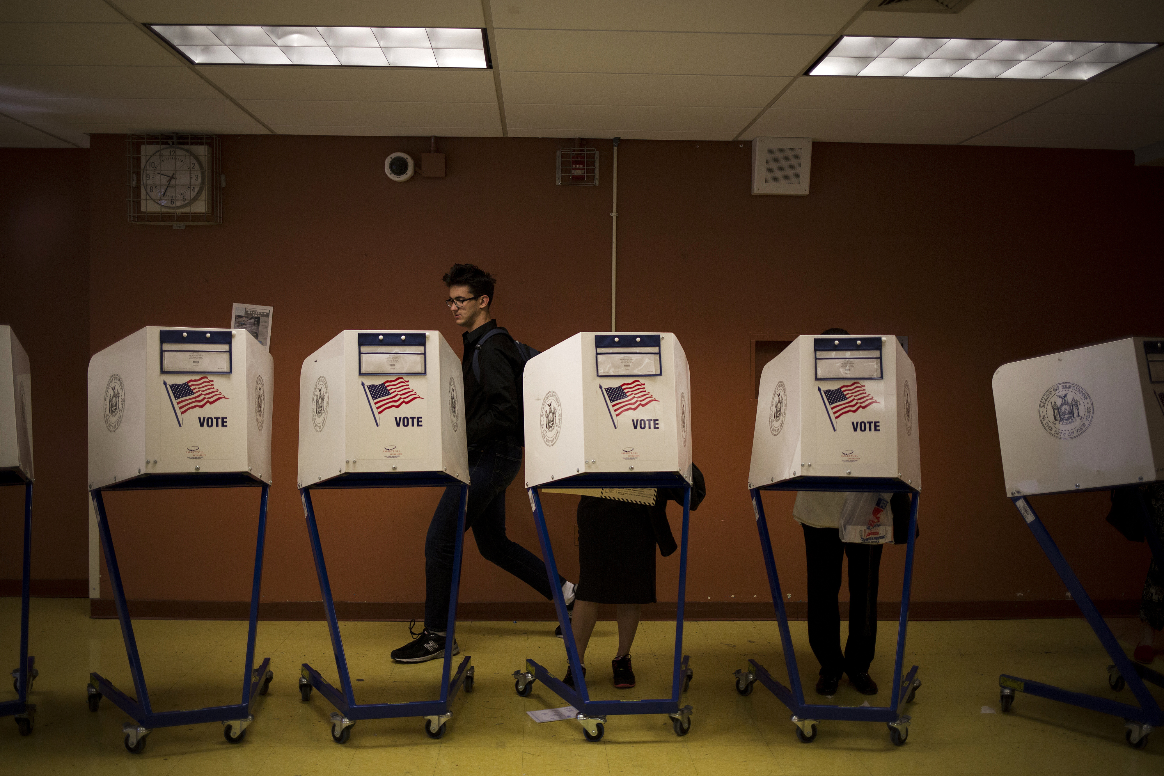 Residents cast ballots during the presidential primary vote at a polling location in New York on April 19, 2016. (Bloomberg/Getty Images)