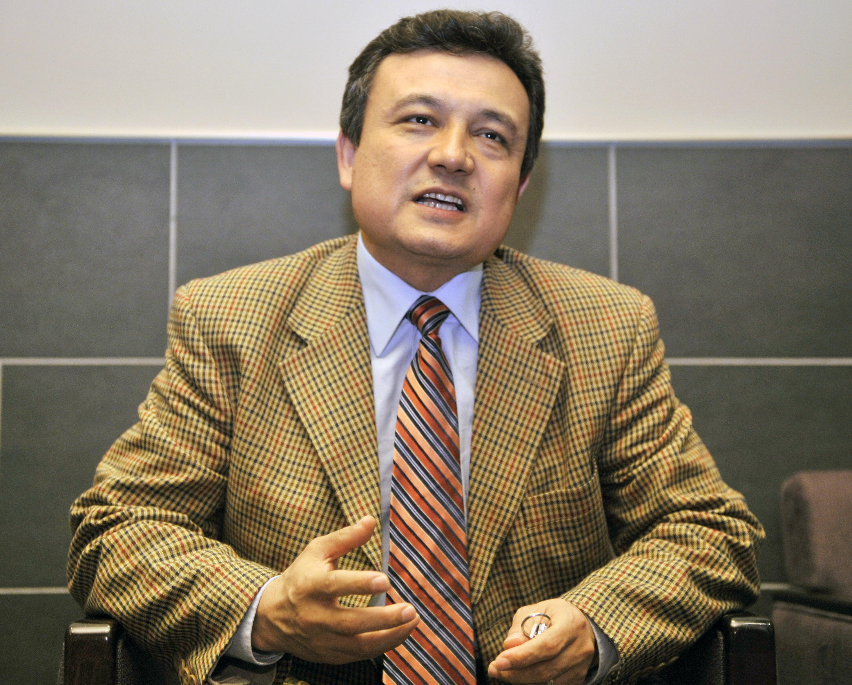 Dolkun Isa, secretary general of the World Uyghur Congress, speaks to a reporter during an interview in Tokyo on May 2, 2008 (YOSHIKAZU TSUNO—AFP/Getty Images)