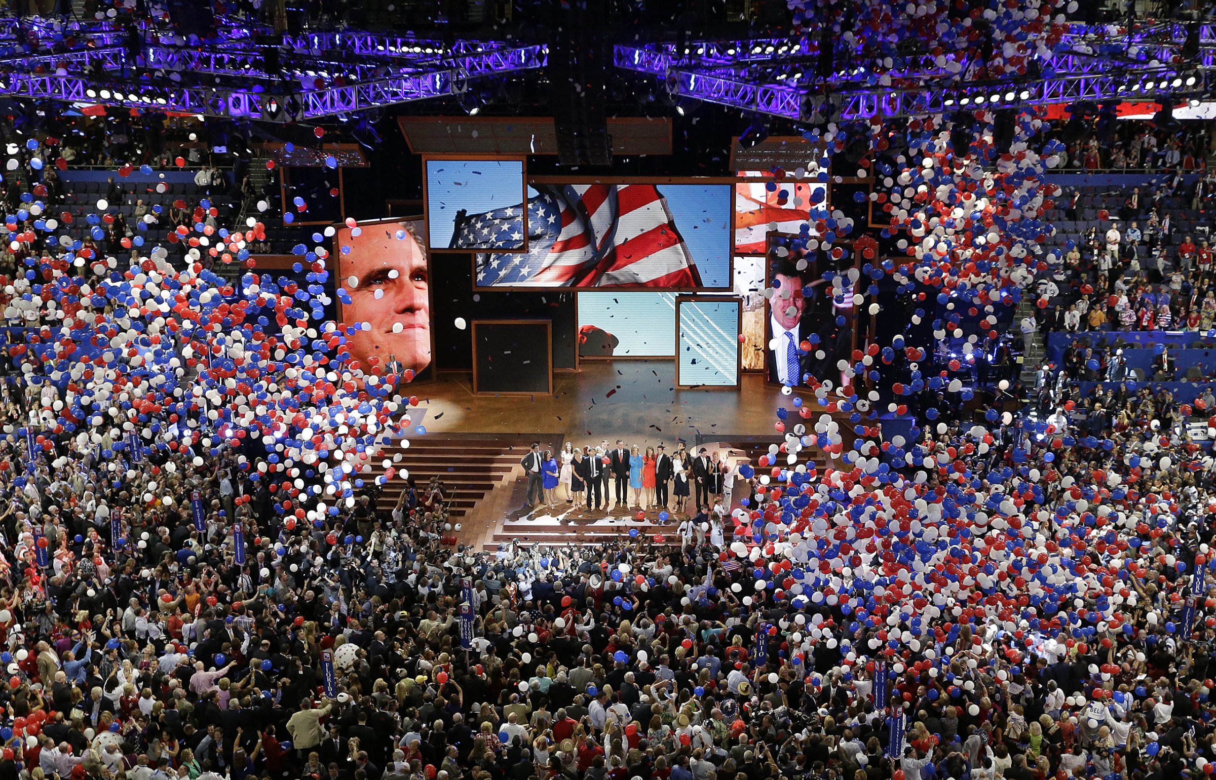 In this Aug. 30, 2012, file photo, Republican presidential nominee Mitt Romney and vice presidential nominee Rep. Paul Ryan are joined on the stage by their families at the end of the Republican National Convention in Tampa, Fla.