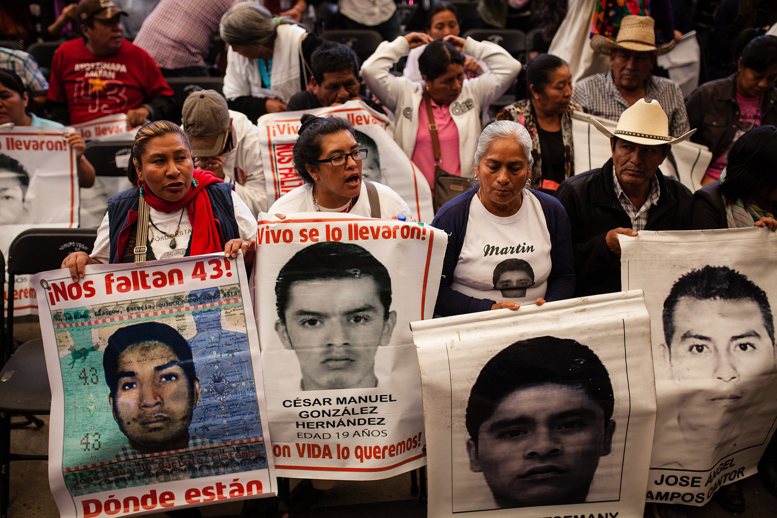 Relatives of the 43 missing students in Ayotzinapa stage a protest during the news conference of the Interdisciplinary Group of Independent Experts to publicize details of the report about the disappearances in Mexico City, Mexico, April 24, 2016. (Manuel Velasquez—Anadolu Agency/Getty Images)