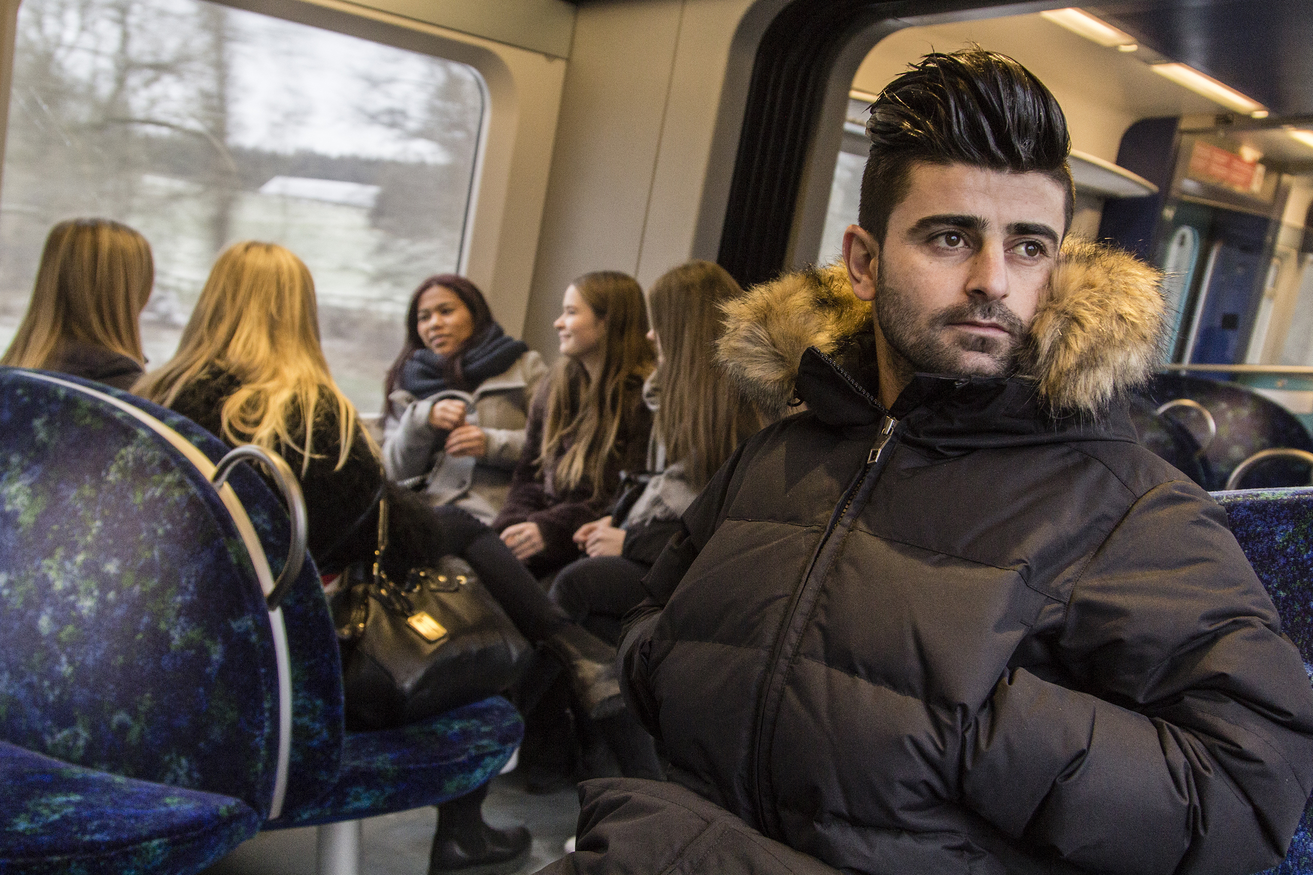 Qanie Nazari, a stateless  asylum seeker living in Denmark, rides a commuting train in Sandholm. Jan. 2016.