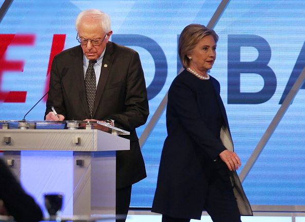 Democratic presidential candidate Senator Bernie Sanders (D-VT) and Democratic presidential candidate Hillary Clinton are seen on stage during a break in the broadcast of the Univision News and Washington Post Democratic Presidential Primary Debate at the Miami Dade College's Kendall Campus on March 9, 2016 in Miami, Florida.
