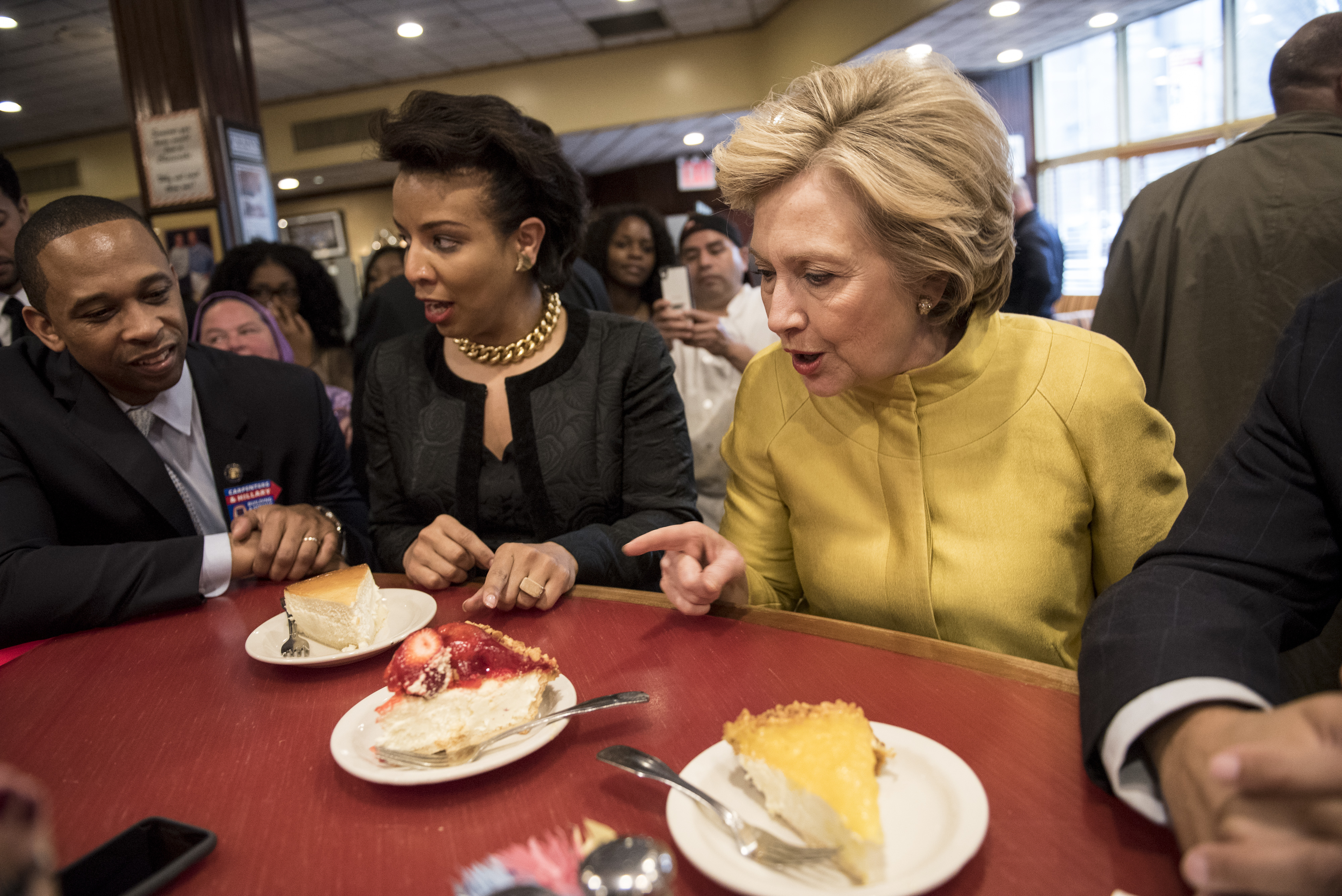 Hillary Clinton speaks with councilwoman Laurie Cumbo at Junior's restaurant while campaigning in Brooklyn, New York City on April 9, 2016. (Andrew Renneisen—Getty Images)