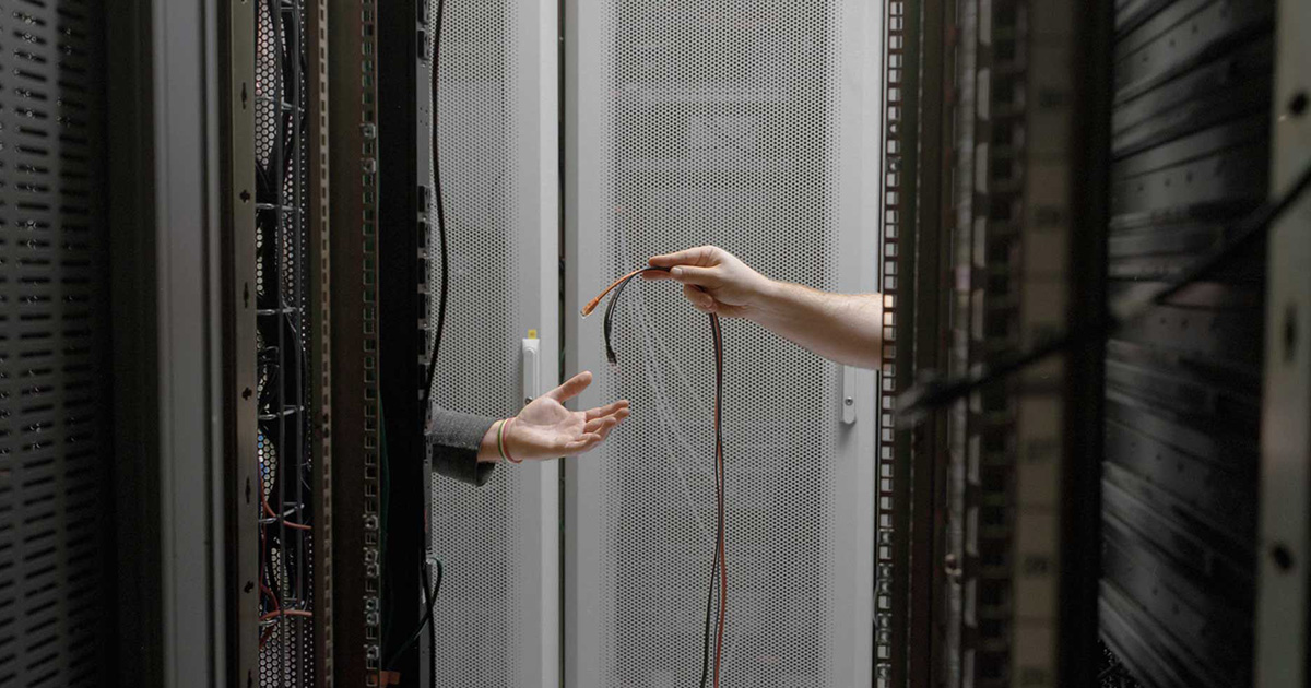 Fiber optic cables are fitted to a server, replacing slower copper cabling. Copper is still prevalent in many data centers but fiber optic cable (thin strands of silica glass) replaces copper where greater bandwidth is needed.