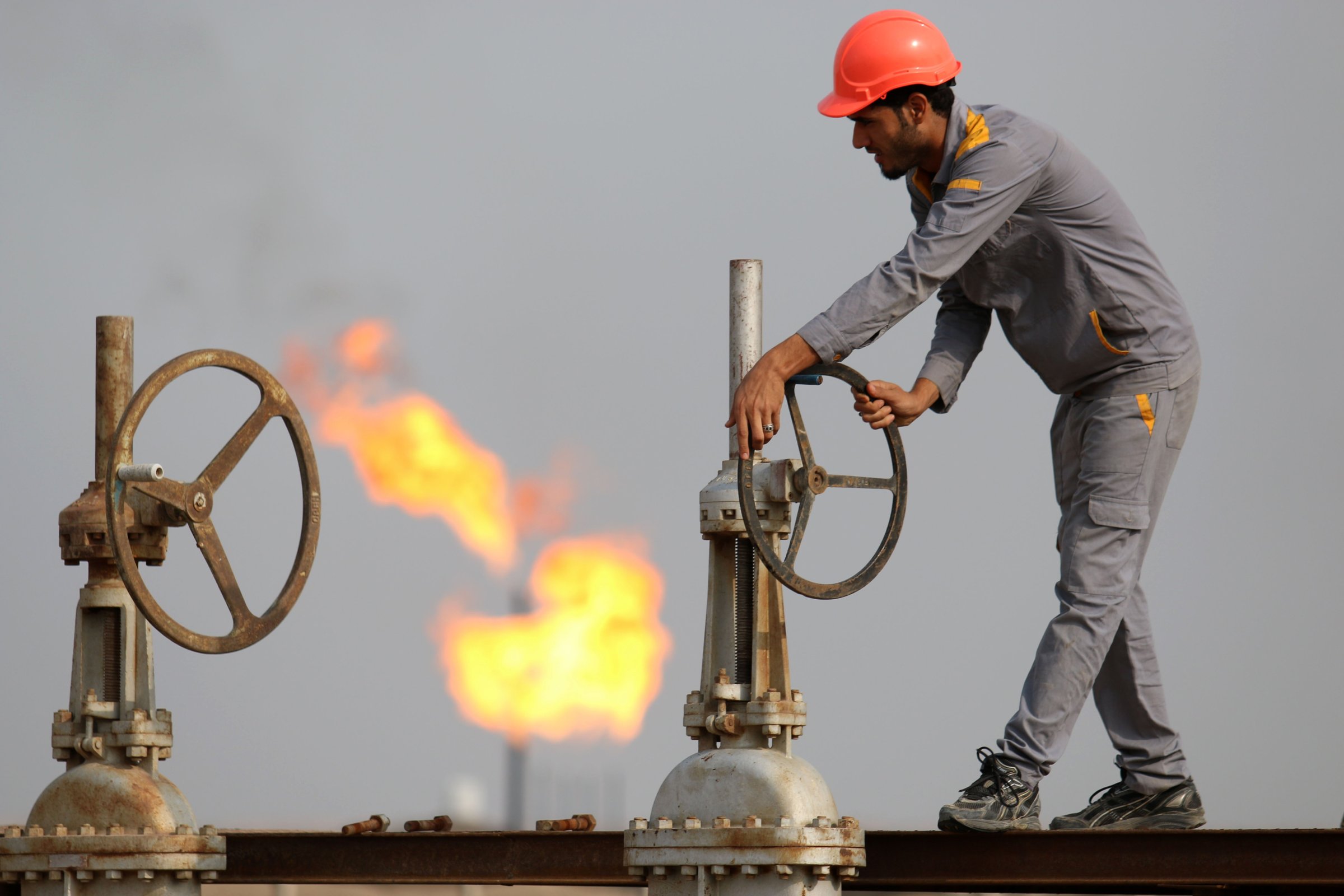 An Iraqi labourer works at an oil refinery in the southern town Nasiriyah on October 30, 2015.