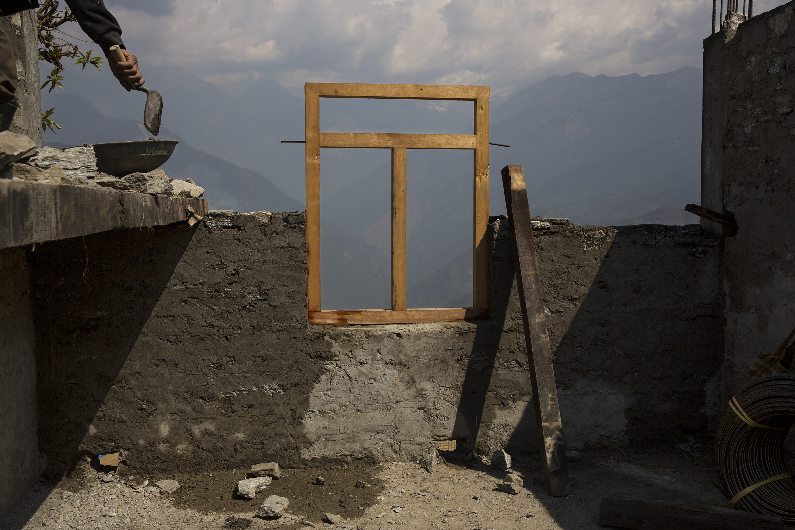Approaching the first anniversary of Nepal's 2015 quakes, money from international donors has yet to reach victims. A political fight overtook reconstruction efforts, leaving villagers in communities like Barpak, needing to rebuild on their own, April 7, 2016.From  James Nachtwey: A Year After the Devastating Earthquake