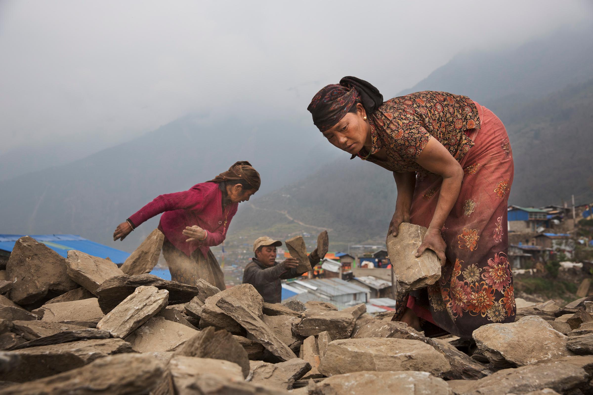 The village of Barpak, in Gorkha district, close to the epicenter of the earthquake, which destroyed almost the entire village. Villagers rebuilding houses and pathways and building a new religious stupa. Much of the work is accomplished communally.by James Nachtwey