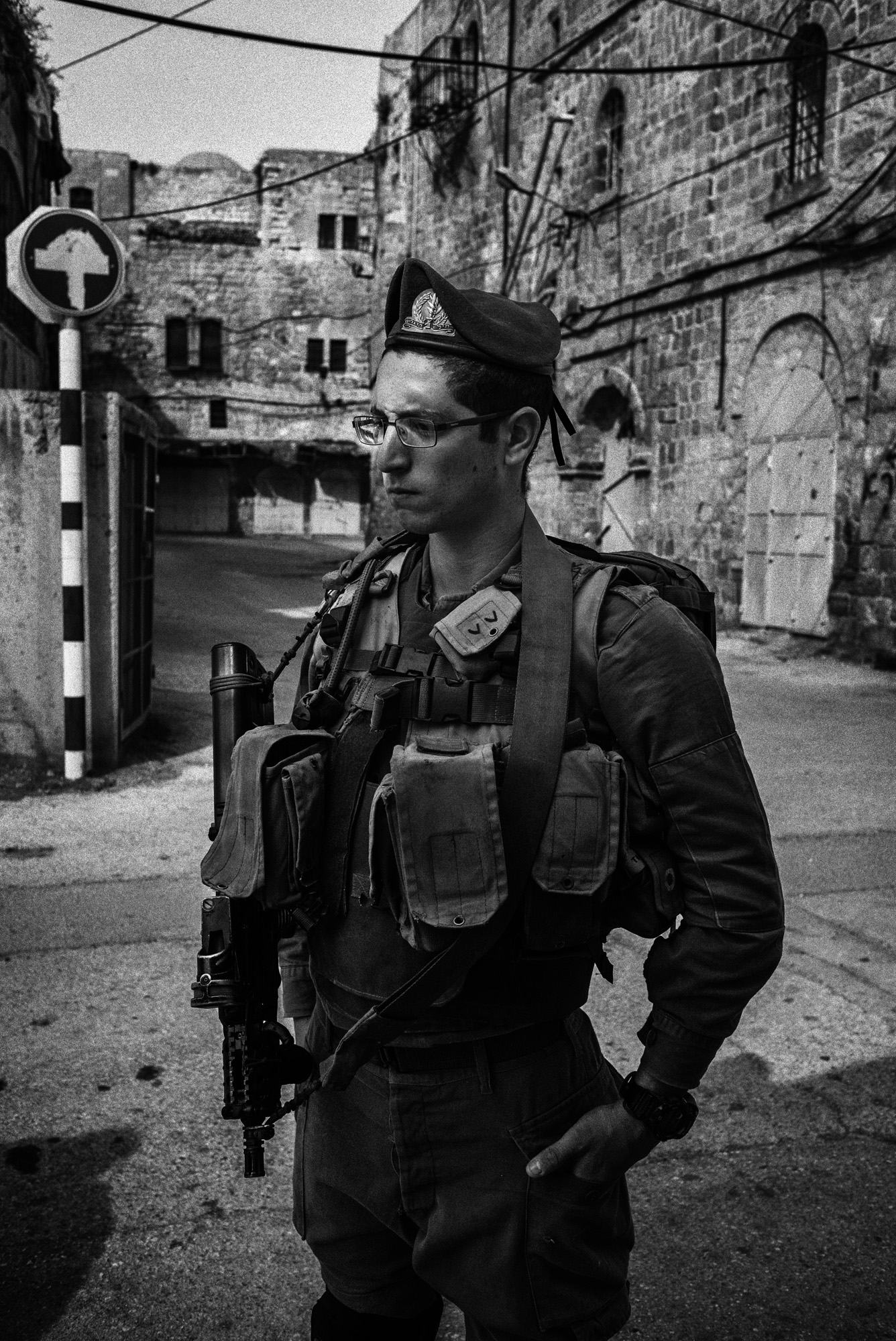 An Israeli soldier stands at a checkpoint in the H2 area of Hebron, November 2015. In late October a Palestinian man was fatally shot here while. Amnesty International said he was retrieving an ID card at the request of a soldier. The rights organization said Israeli authorities labeled the incident an "attempted stabbing."