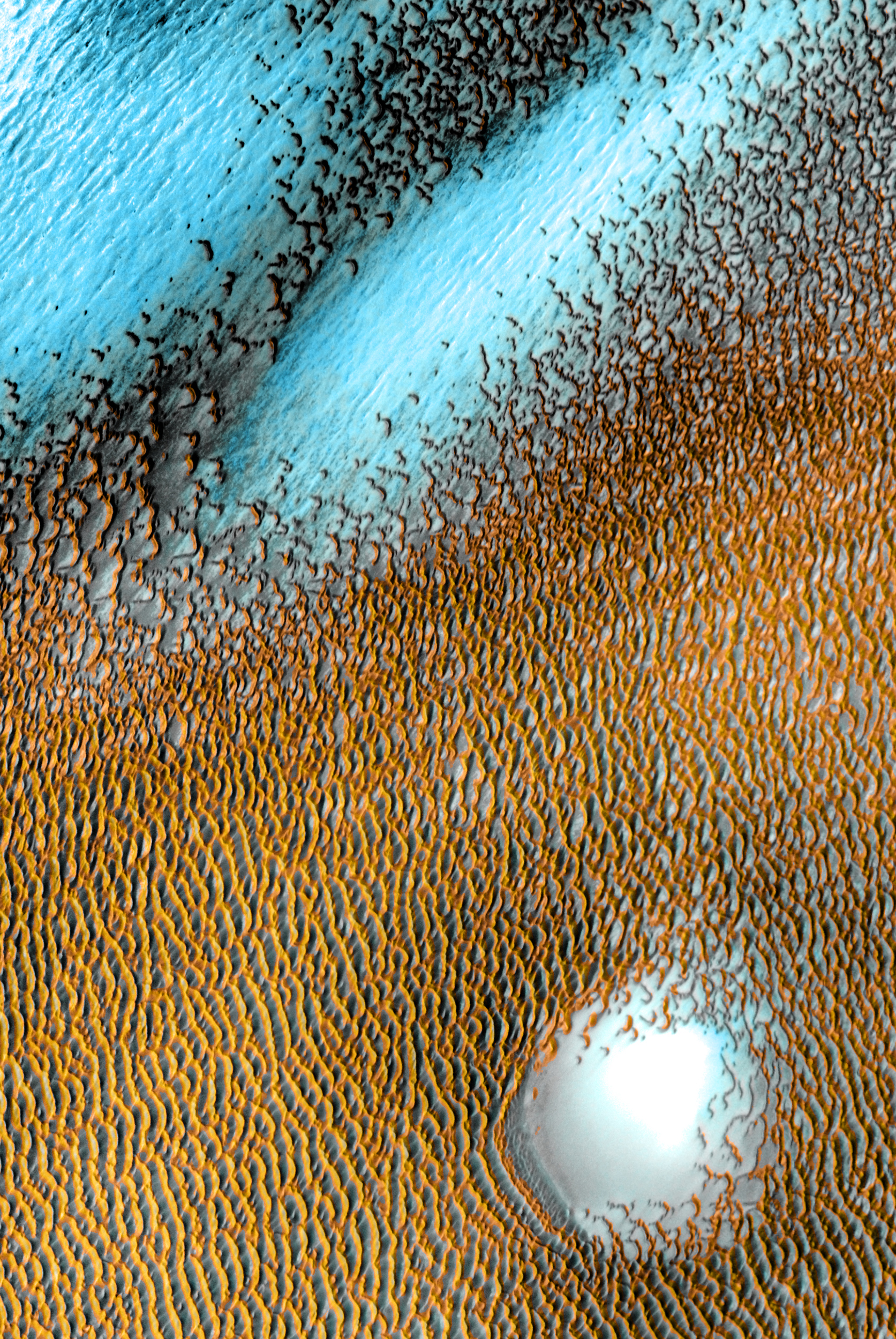 A sea of dark dunes, sculpted by the wind into long lines, surrounds the northern polar cap. This image covers an area 19 miles wide. This scene combines images taken during the period from Dec. 2002 to Nov. 2004 by the Thermal Emission Imaging System instrument on NASA's Mars Odyssey orbiter.