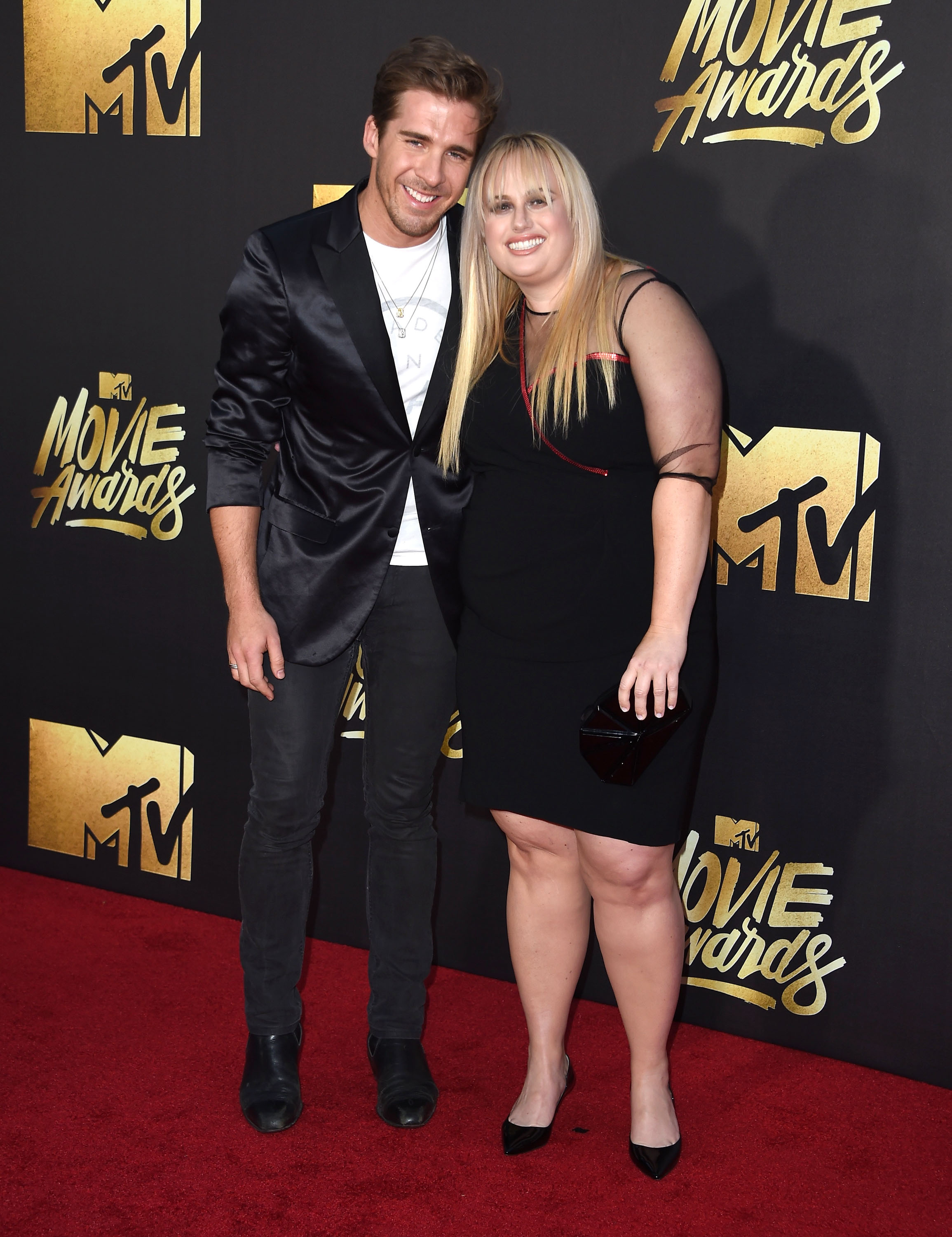 Hugh Sheridan and Rebel Wilson attend the 2016 MTV Movie Awards at Warner Bros. Studios on April 9, 2016 in Burbank, Calif.