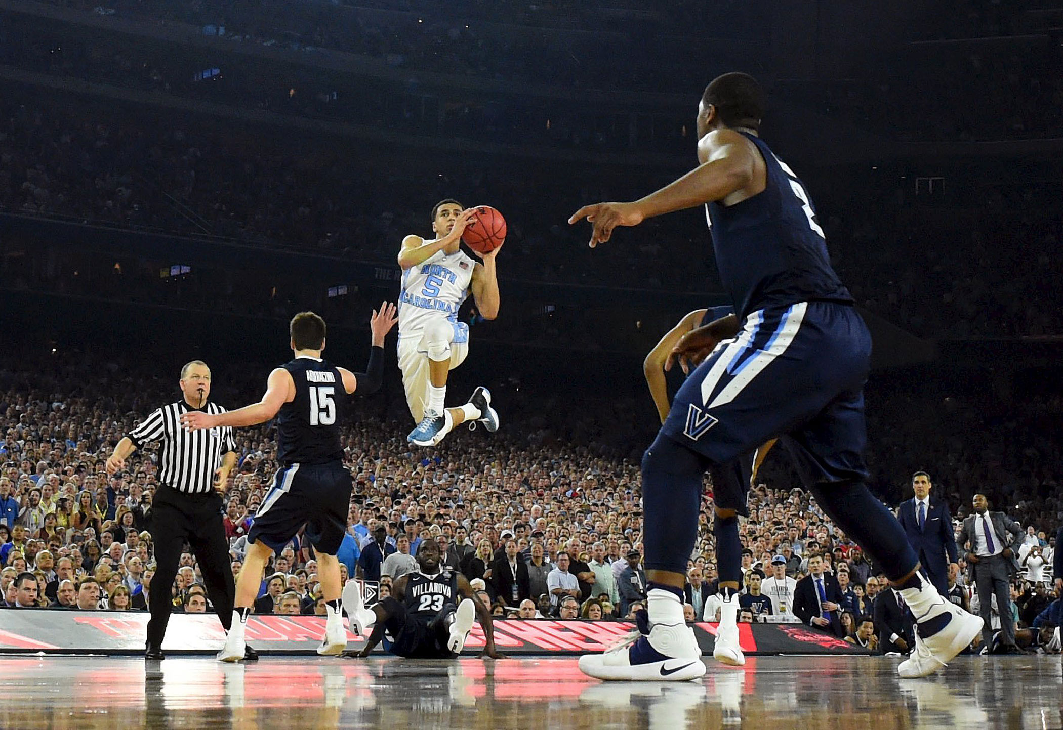 North Carolina Tar Heels guard Marcus Paige (5) shoots and scores a three-point basket against the Villanova Wildcats in the second half of the NCAA college basketball National Championship game on April 4, 2016 in Houston.
