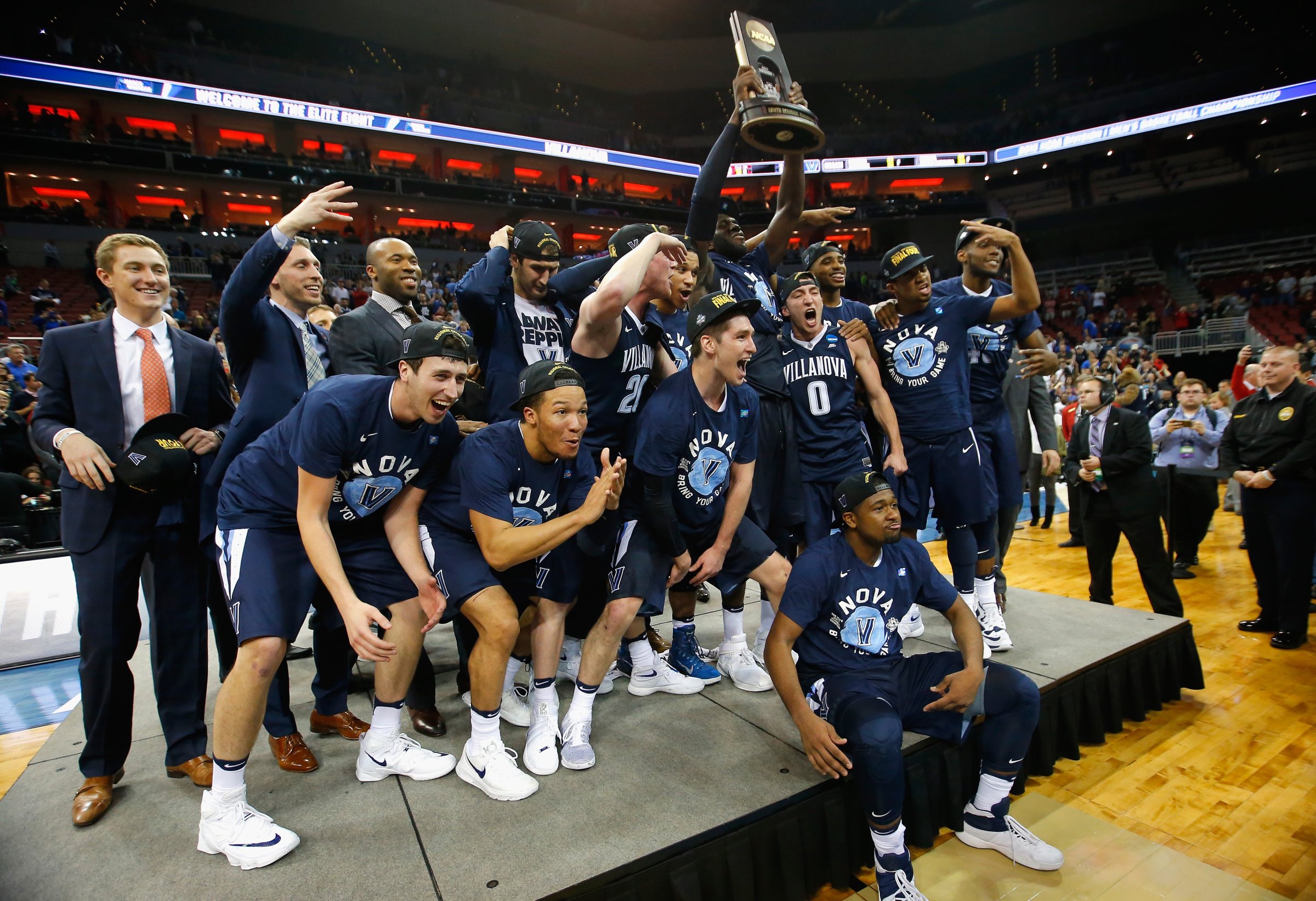 The Villanova Wildcats celebrate defeating the Kansas Jayhawks during the 2016 NCAA Men's Basketball Tournament South Regional on March 26, 2016 in Louisville, Ky.