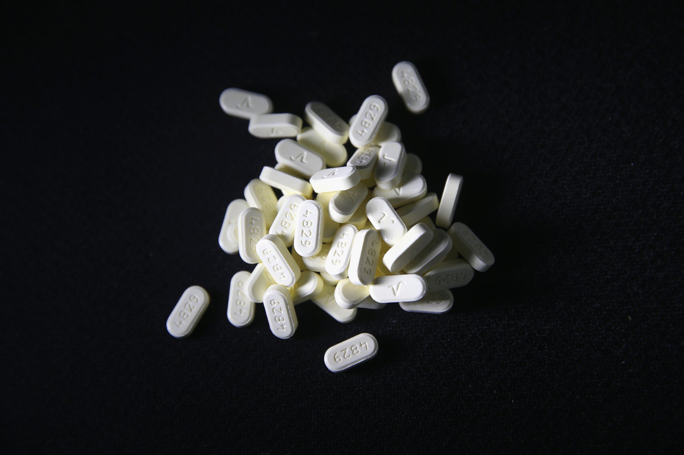 Oxycodone pain pills prescribed for a patient with chronic pain lie on display in Norwich, CT on March 23, 2016.