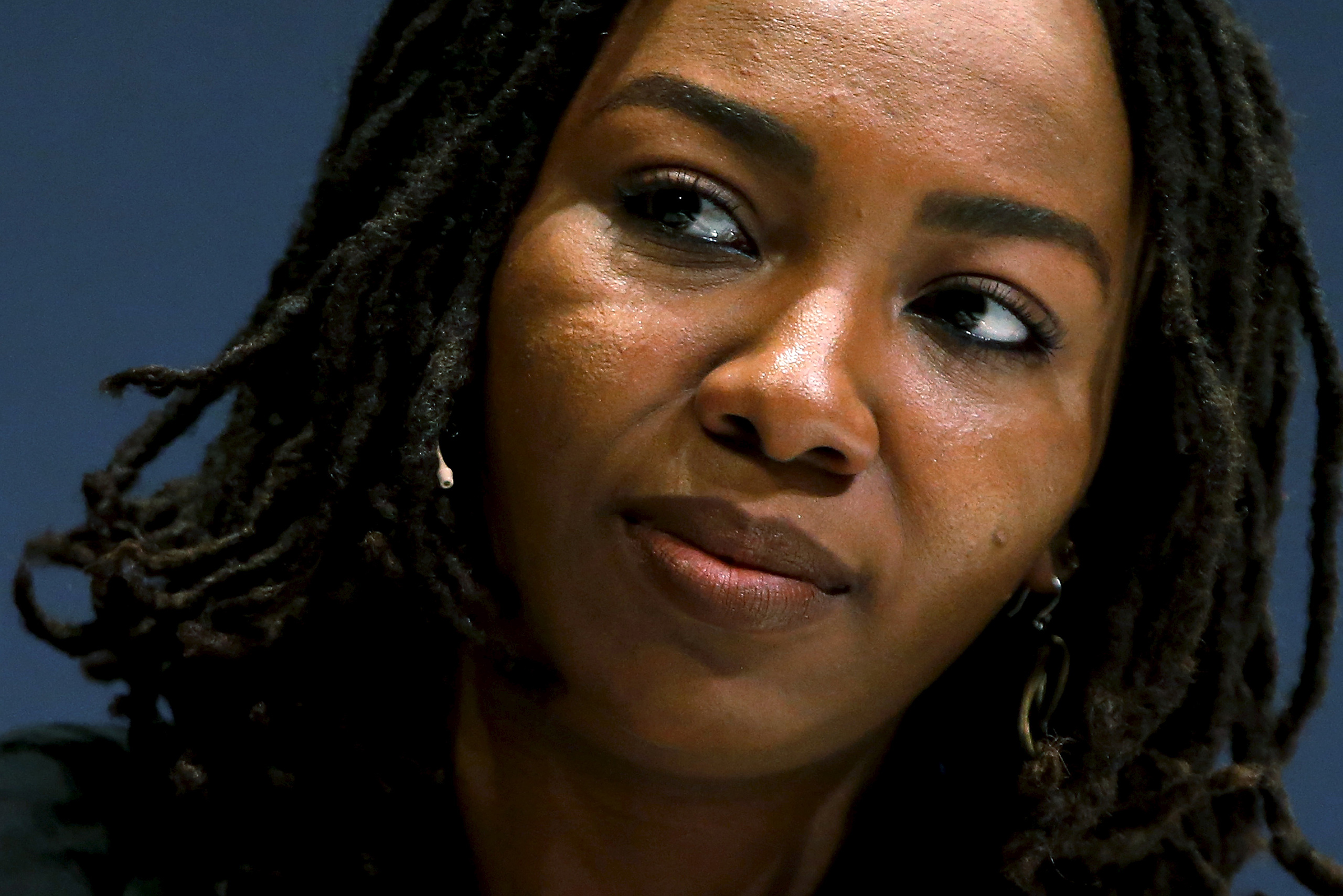 Tometi, the co-founder of the #BlackLivesMatter movement, takes part in an onstage interview at the Washington Ideas Forum in Washington