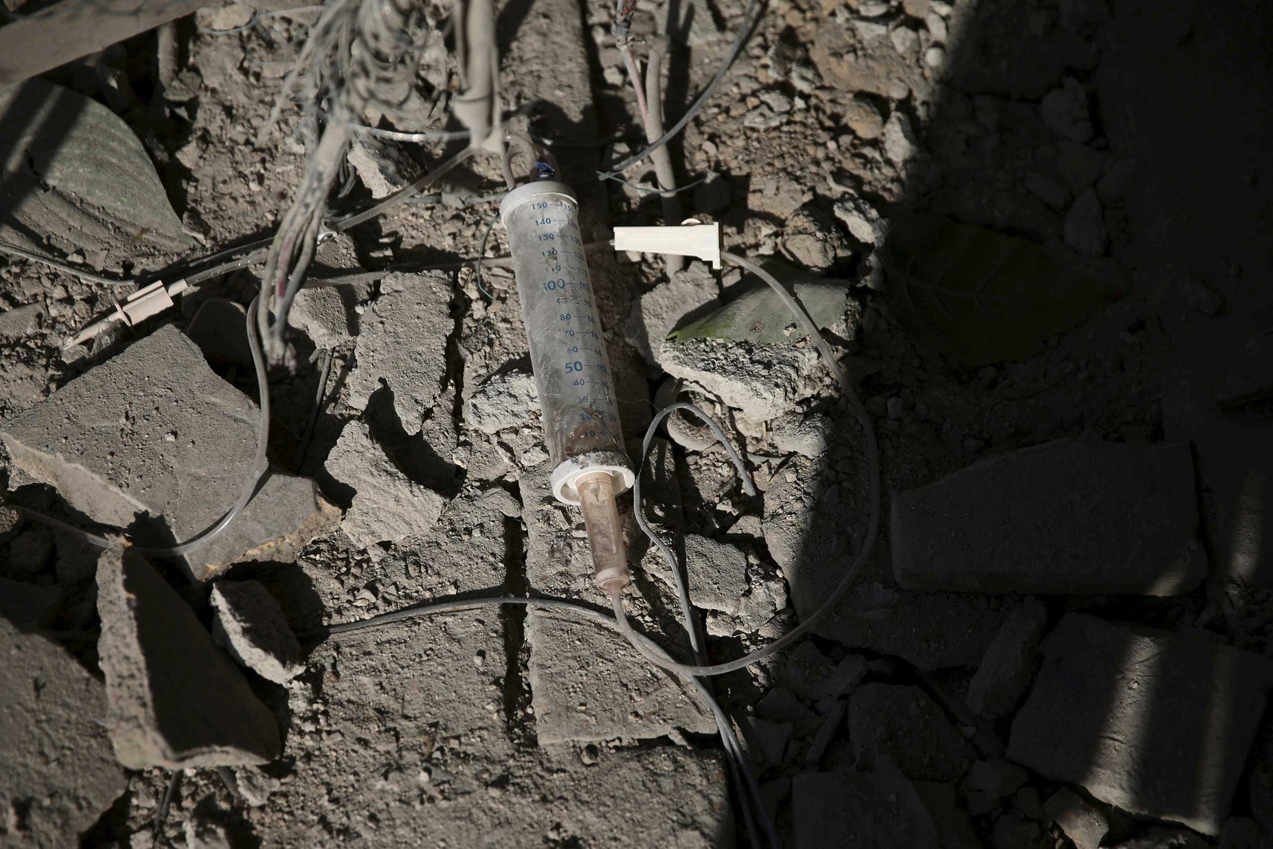 A damaged Intravenous apparatus is pictured outside a damaged newborn nursery after what activists said were air and missile strikes in the Douma neighborhood of Damascus, Syria, Dec. 13, 2015.