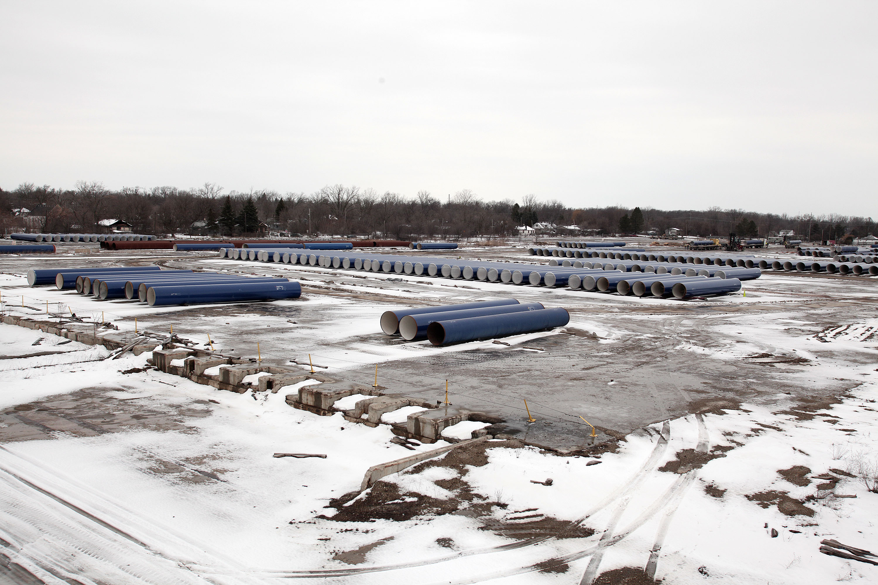 New water pipes awaiting installation are shown along the route of a national mile-long march, which was held to highlight the push for clean water in Flint, Mich., on Feb. 19, 2016.