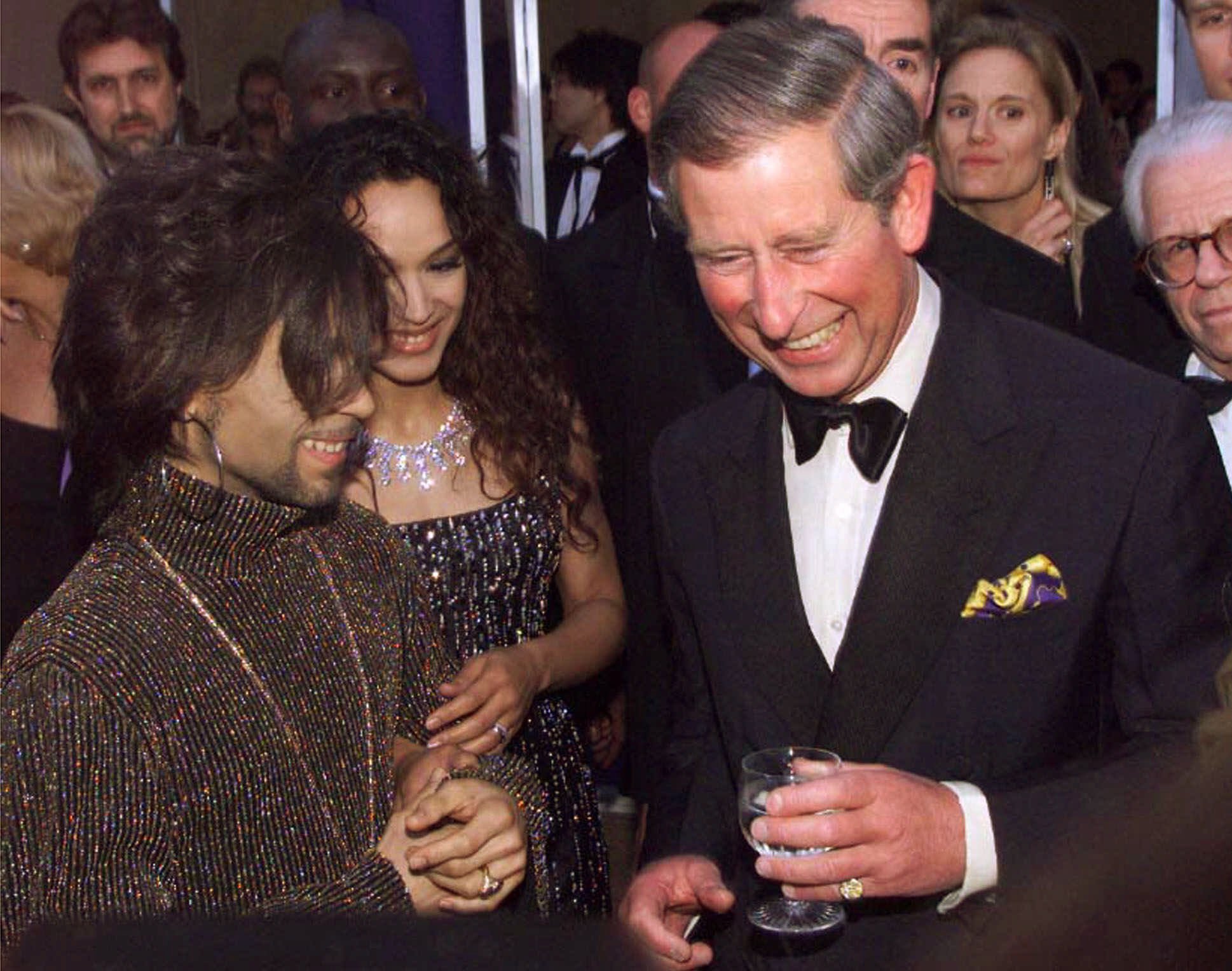 Prince Charles, right, talks with Prince, left, at the "Diamonds are Forever" celebration on June 9, 1999 in London.