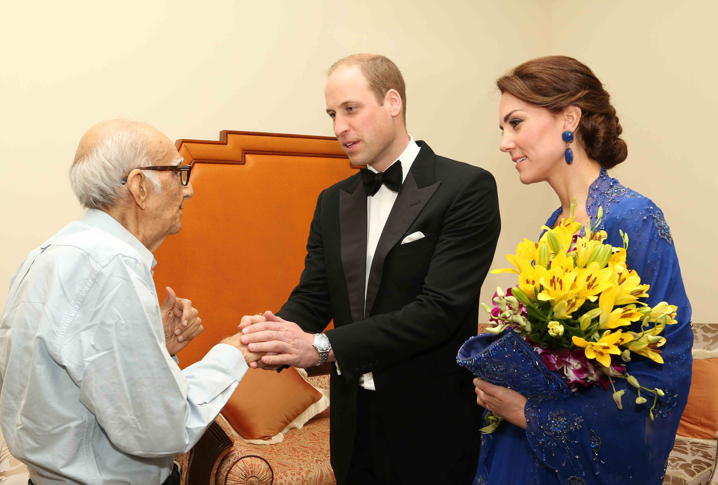 Prince William, Duke of Cambridge and Catherine, Duchess of Cambridge speak with Boman Kohinoor  during a meeting in Mumbai on April 10, 2016.  Kohinoor, 93, has a strong claim to be India's biggest fan of the British royal family.