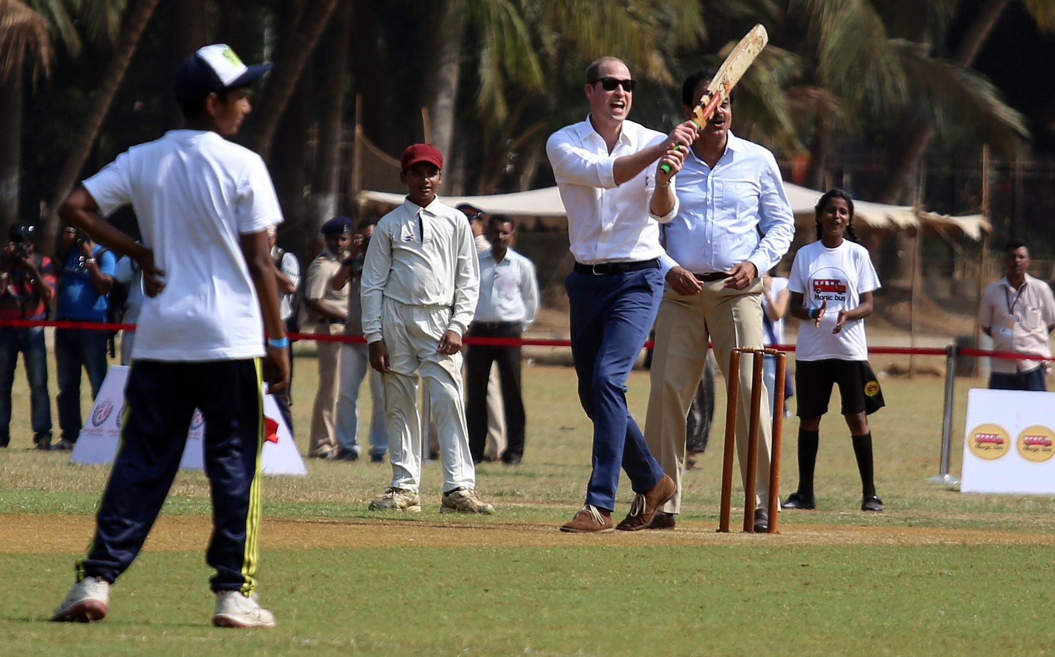 Prince William plays cricket along with children at Oval Maidan recreational ground in Mumbai, India on April 10, 2016.