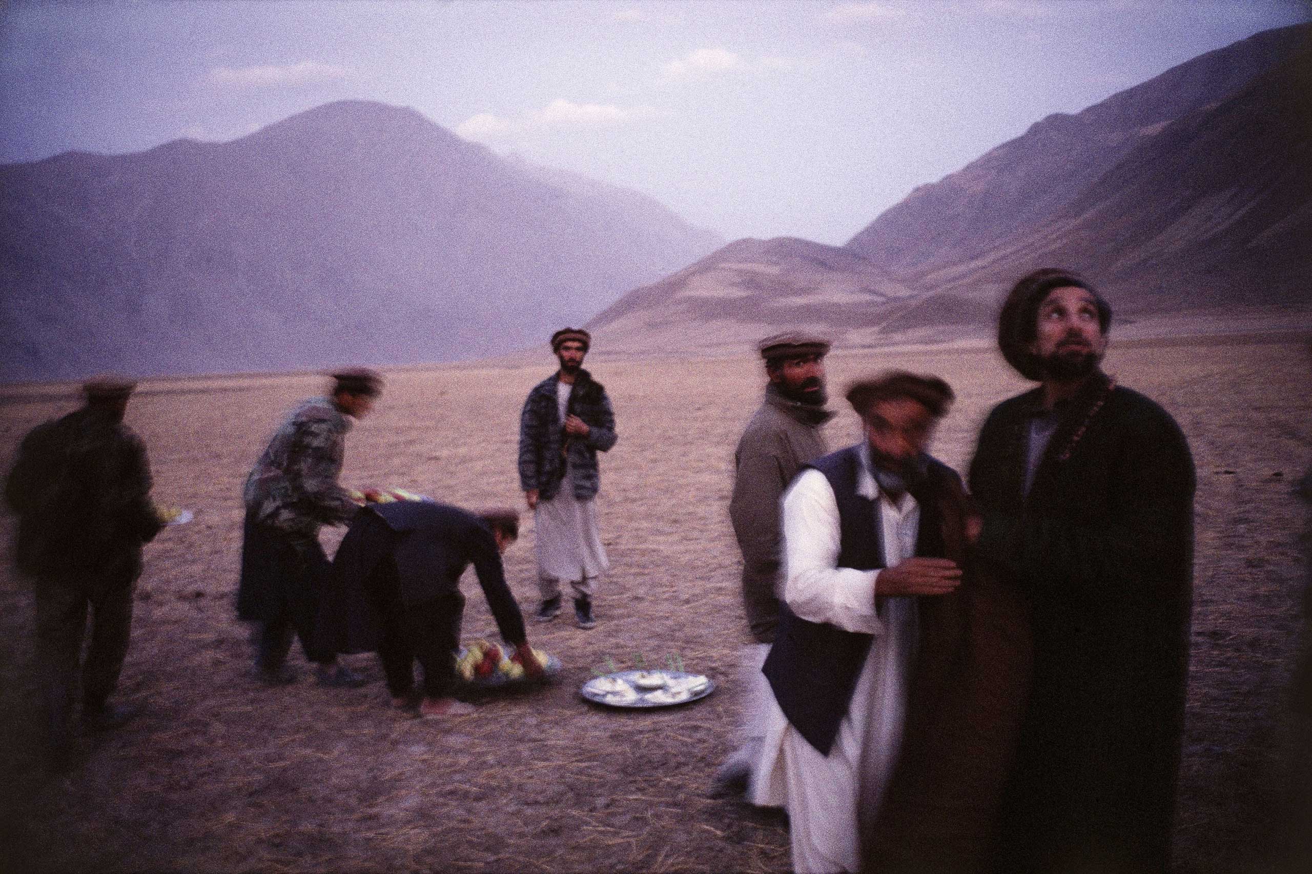Northern Alliance leader Ahmed Shah Massoud with close friends after an early evening prayer service, Feyzabad, Afghanistan, 1998.