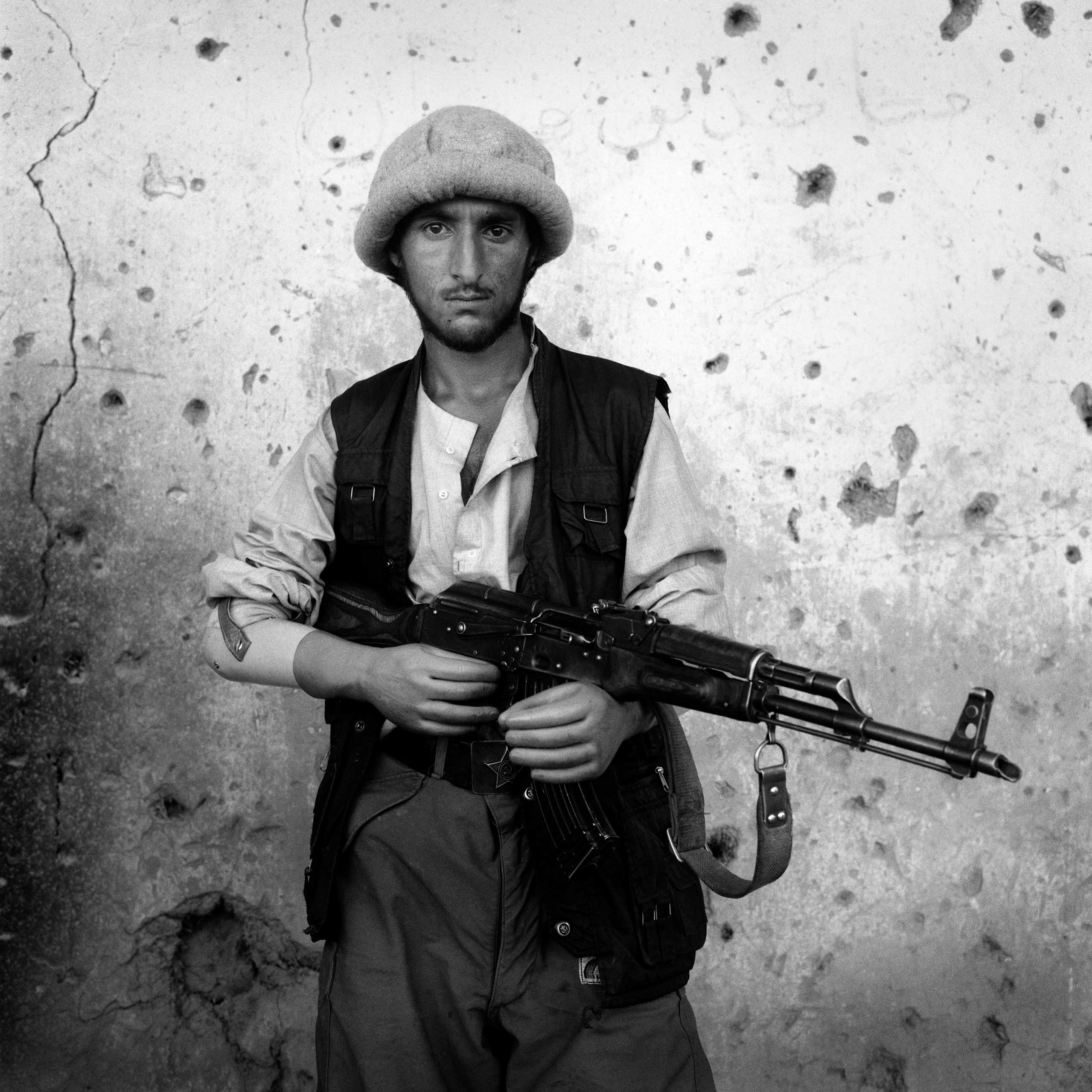 Amputee Northern Alliance soldier on frontline at Bagram Airbase, Afghanistan, 1998.