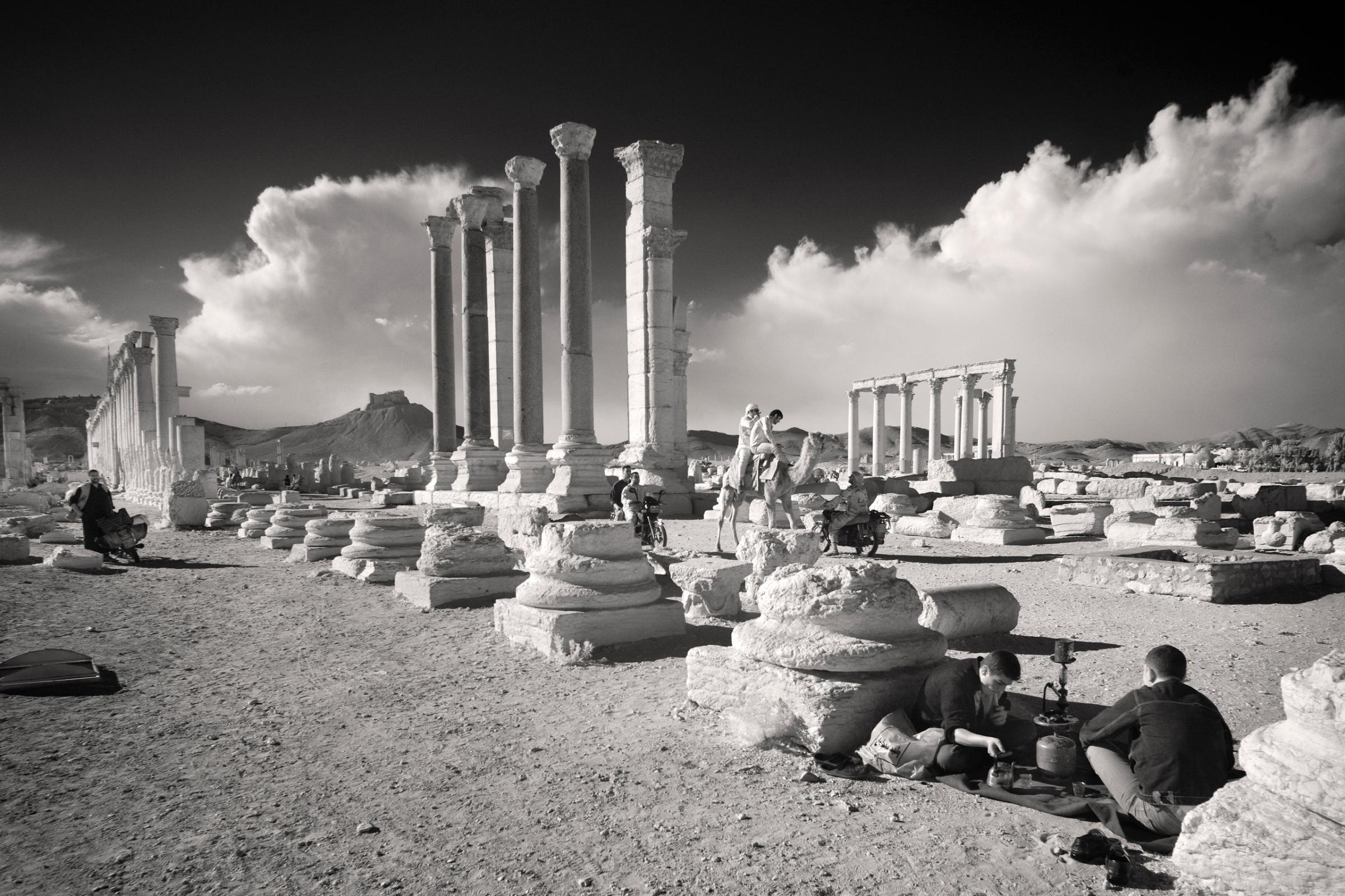 During the Muslim holy day of Friday, many locals picnic, stroll, ride horses, motorbikes among the ruins of Palmyra.