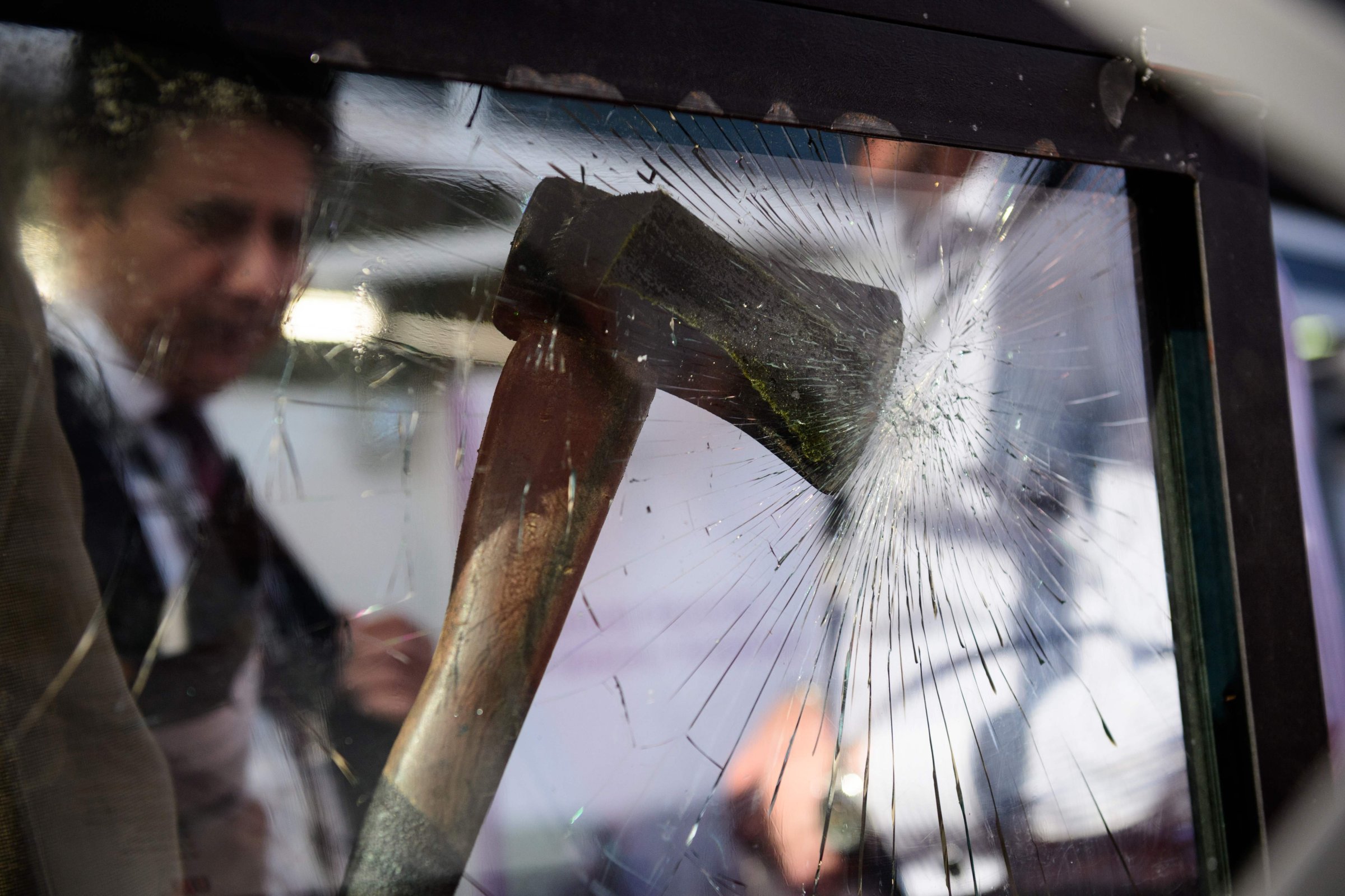 An axe and the effect it has on ballistic glass is displayed during the "Security and Counter Terror Expo" at the Olympia centre in west London on April 19, 2016.