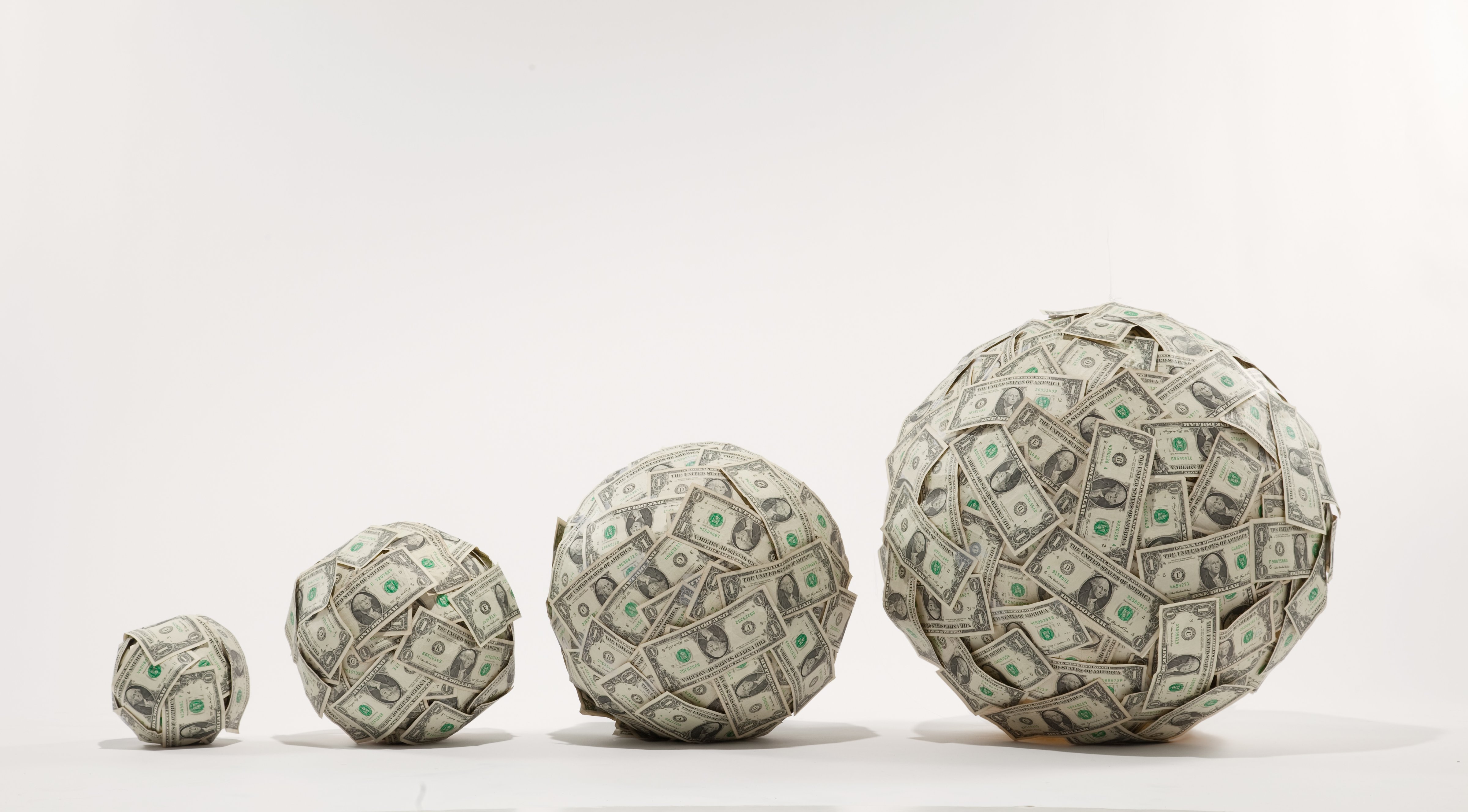 Growing balls of money (Getty Images)