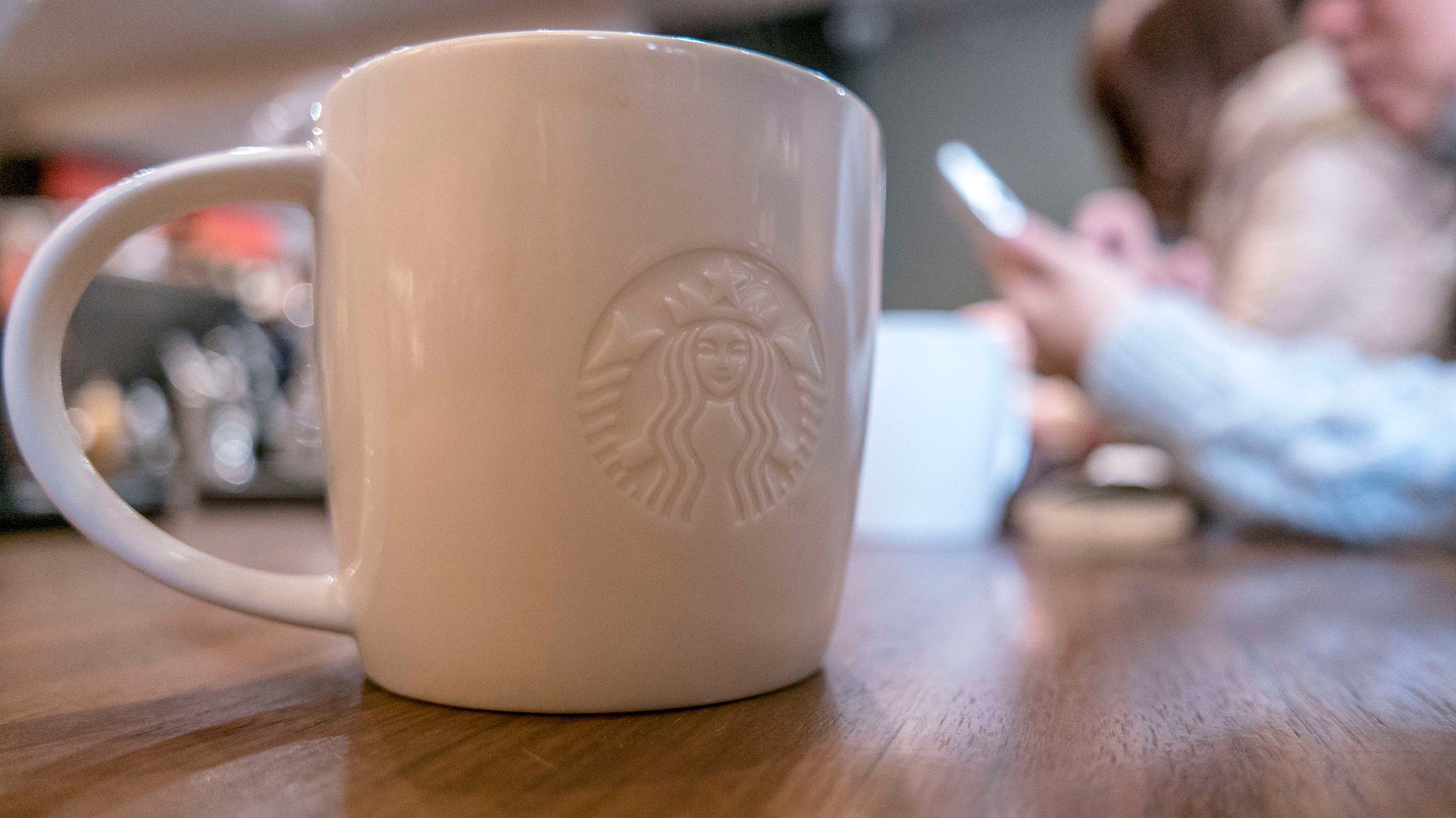 Logo of Starbucks on a coffee mug.