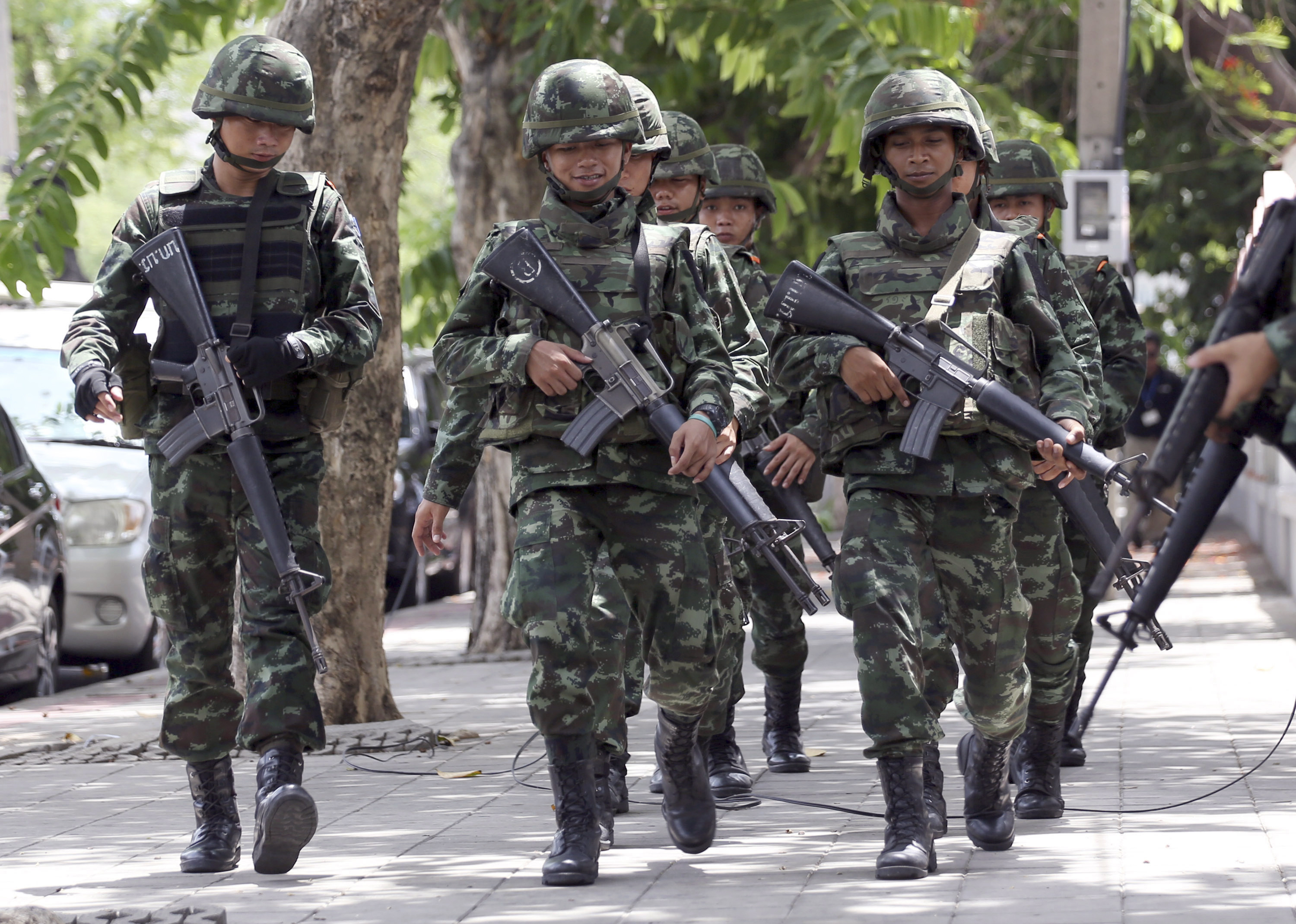 In this May 29, 2014, file photo, Thai soldiers march while changing positions with fellow soldiers on a street in Bangkok (Apichart Weerawong&mdash;AP)